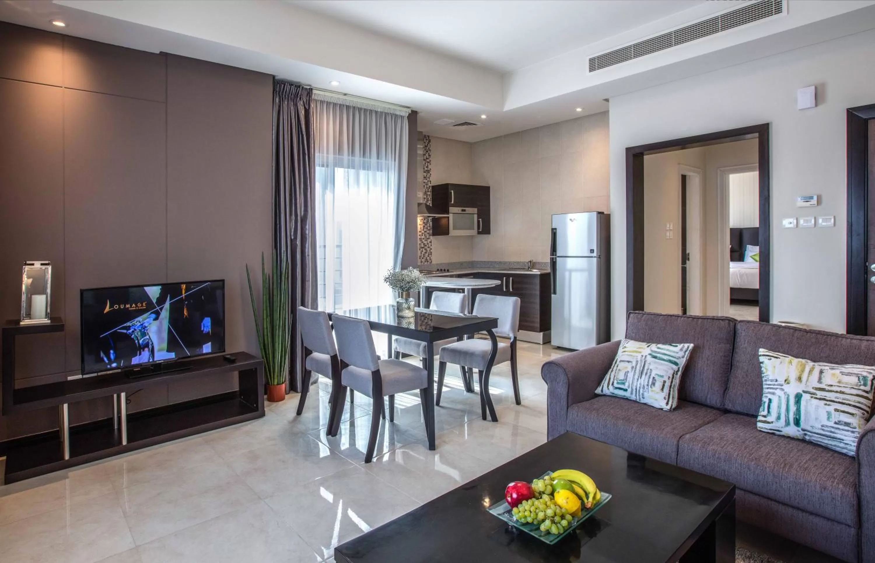 Communal lounge/ TV room in Loumage S Suites and Spa