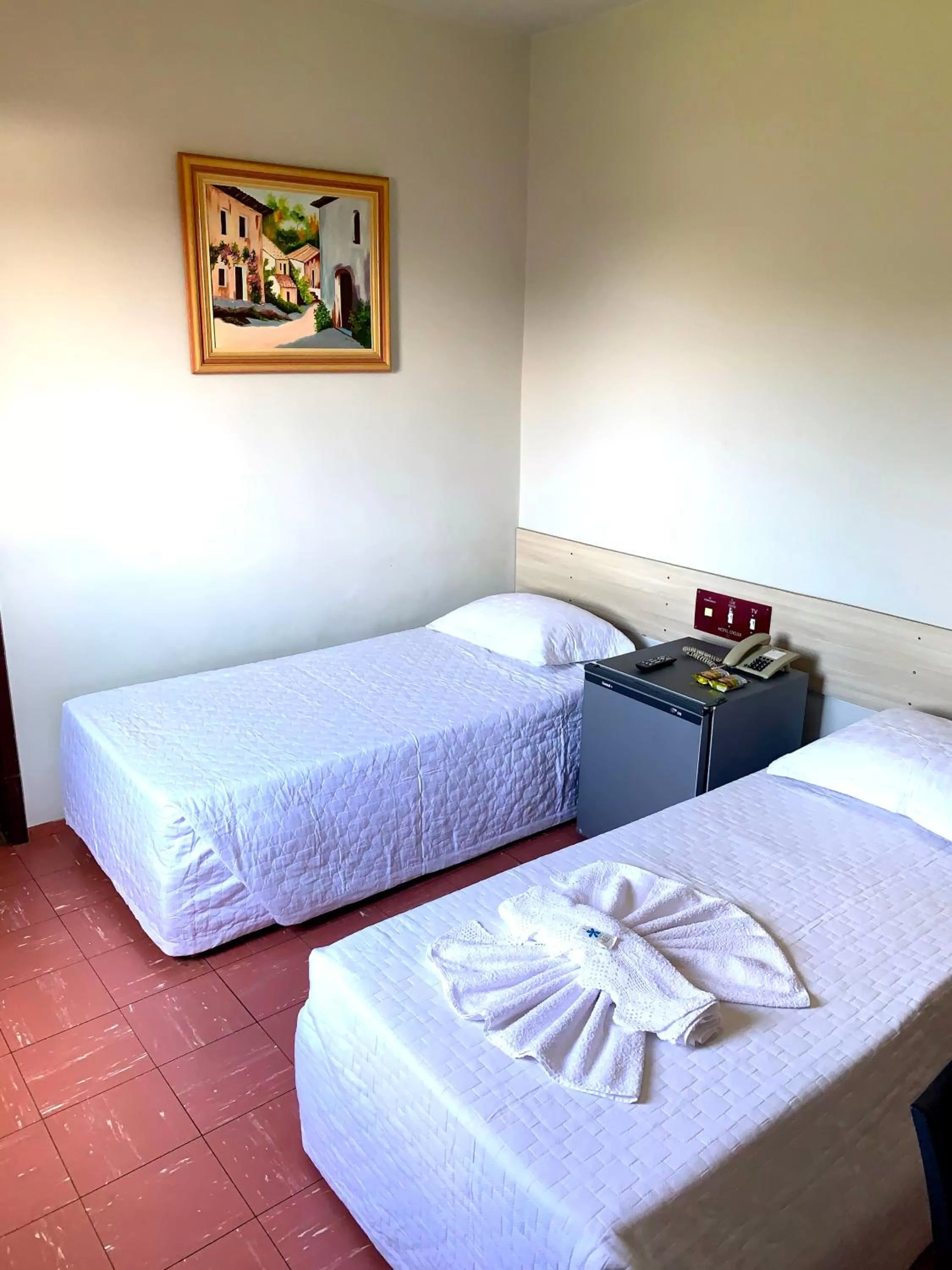 Bed in Hotel Caçula