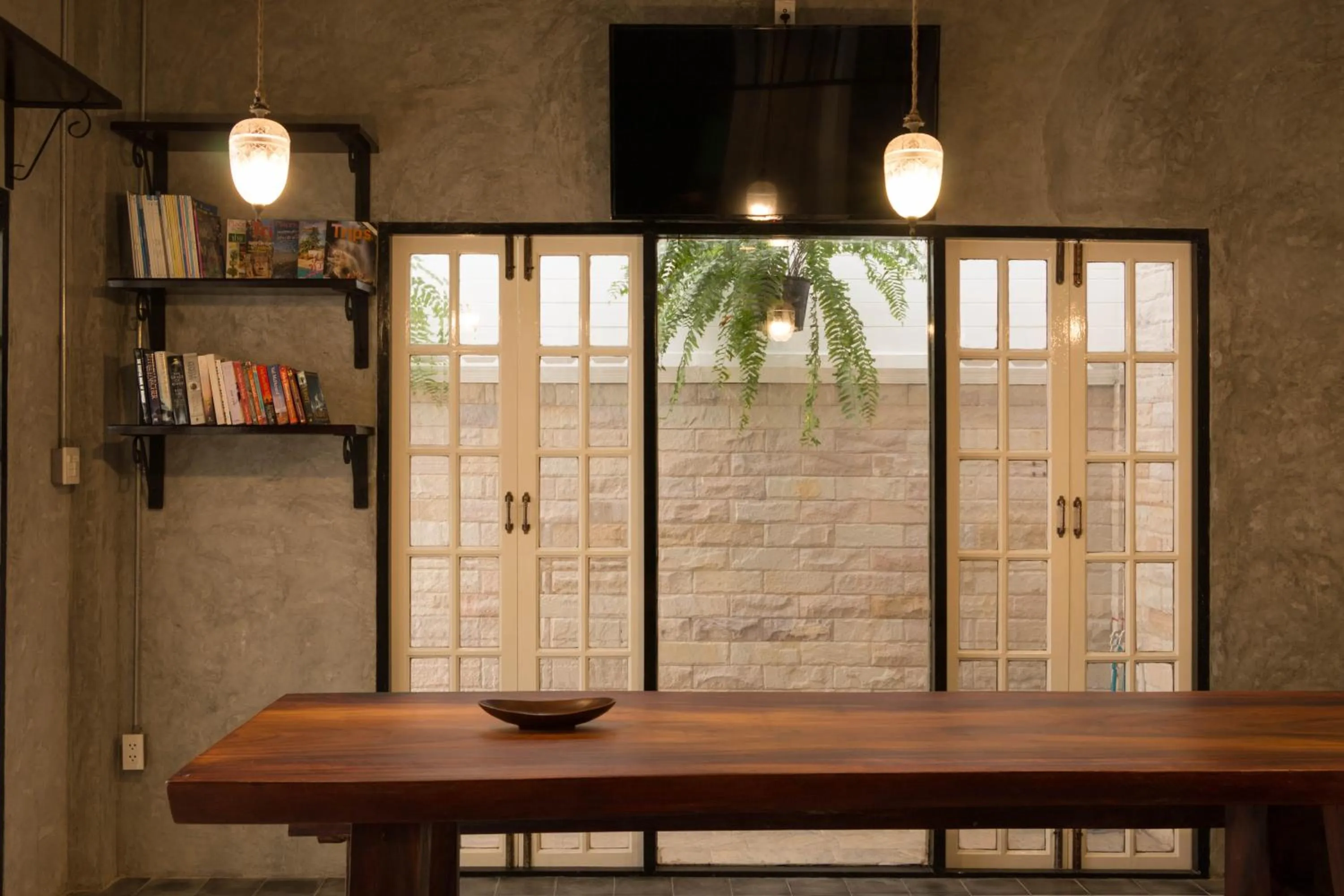 Communal lounge/ TV room in X9Hostel