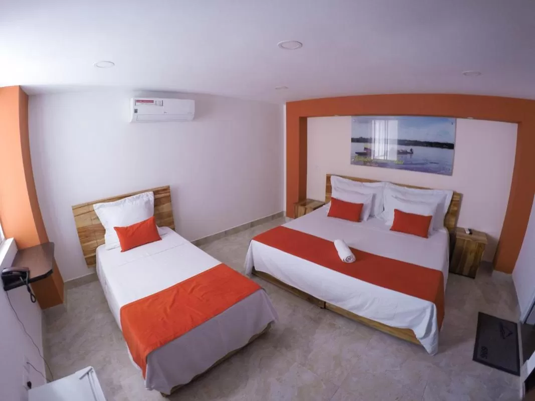 Bed in Kamaleb Farallones Hotel