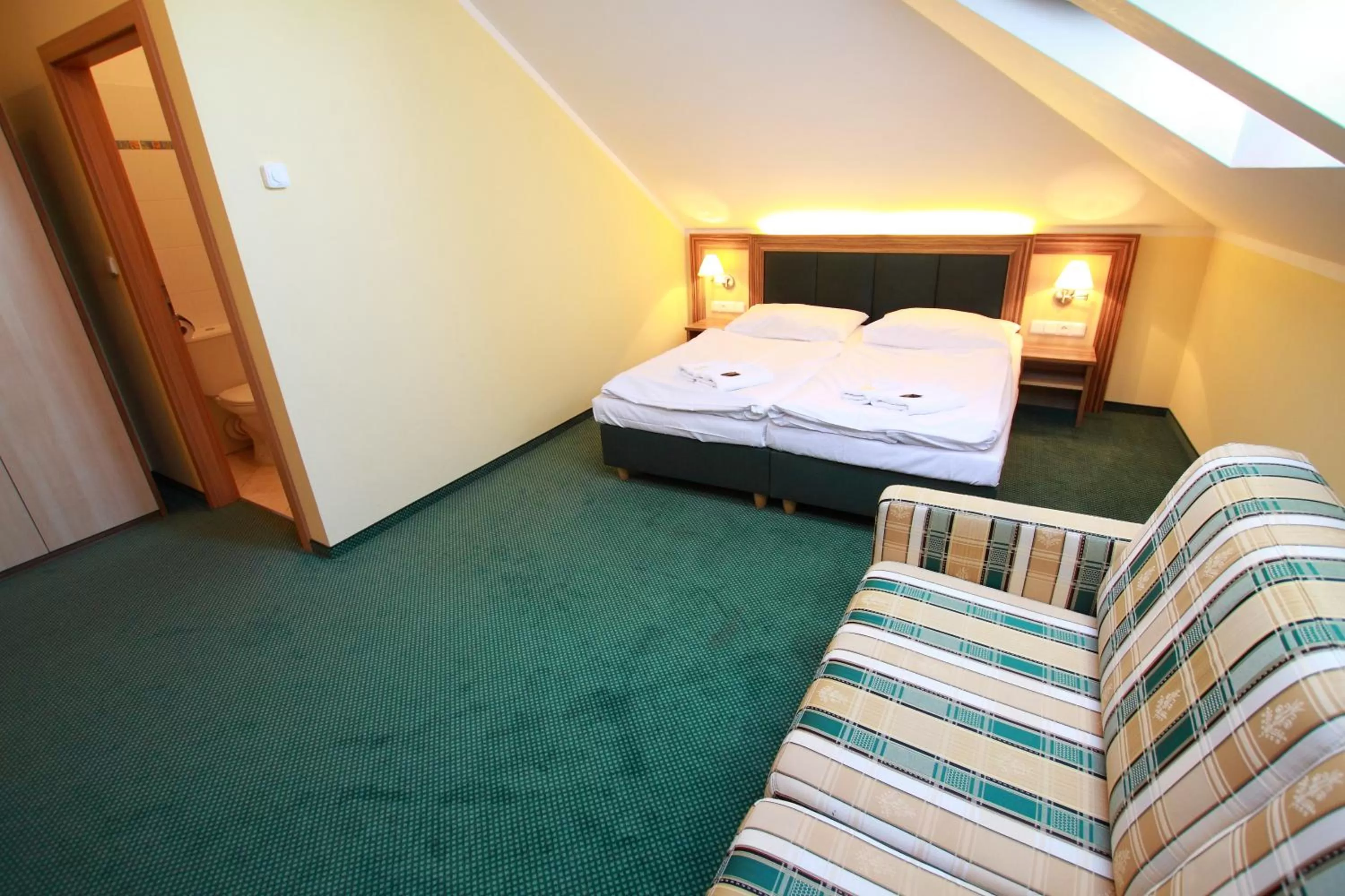 Seating area, Bed in Hotel U Divadla