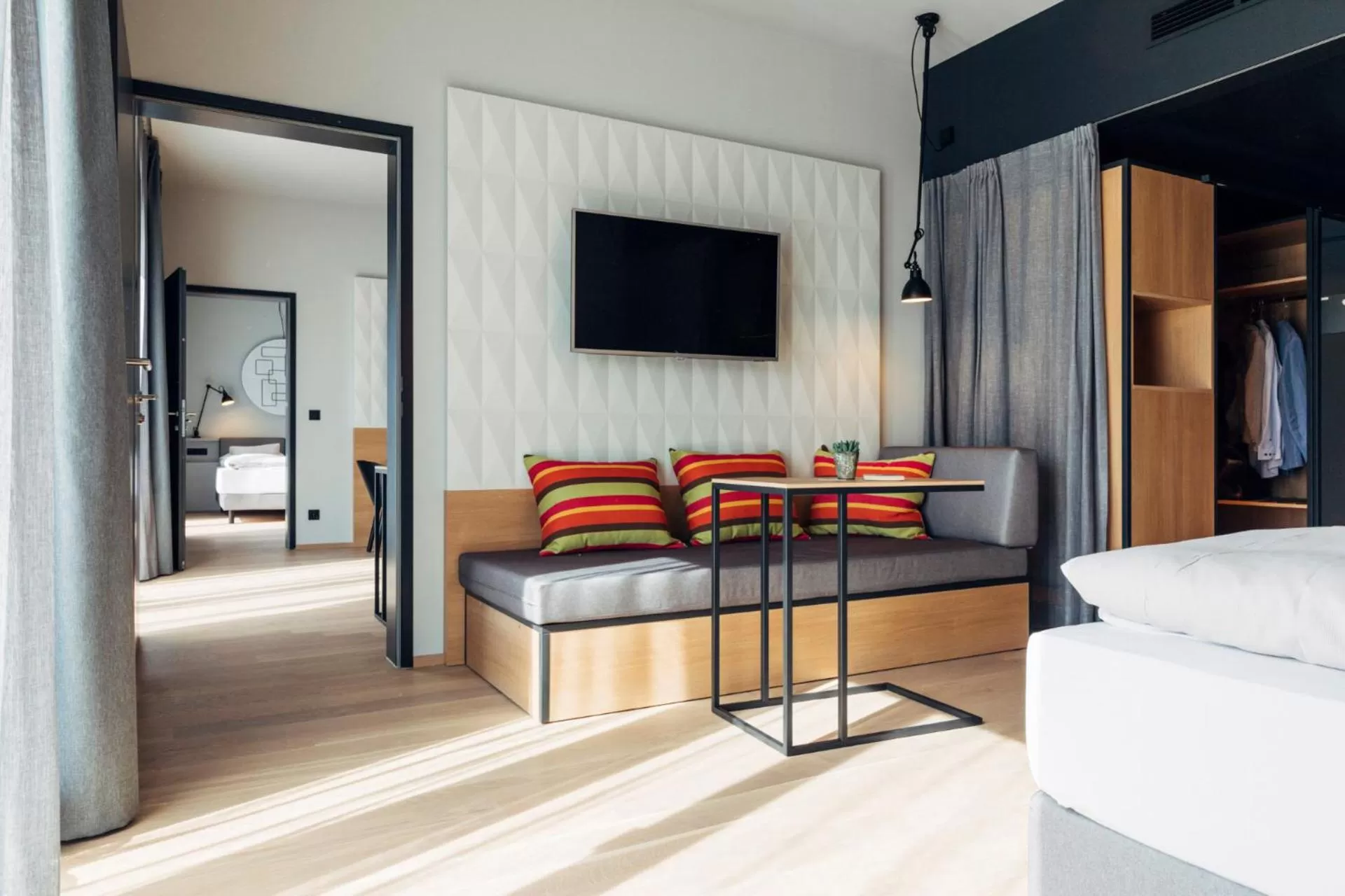 Seating area, Bed in harry's home Steyr hotel & apartments