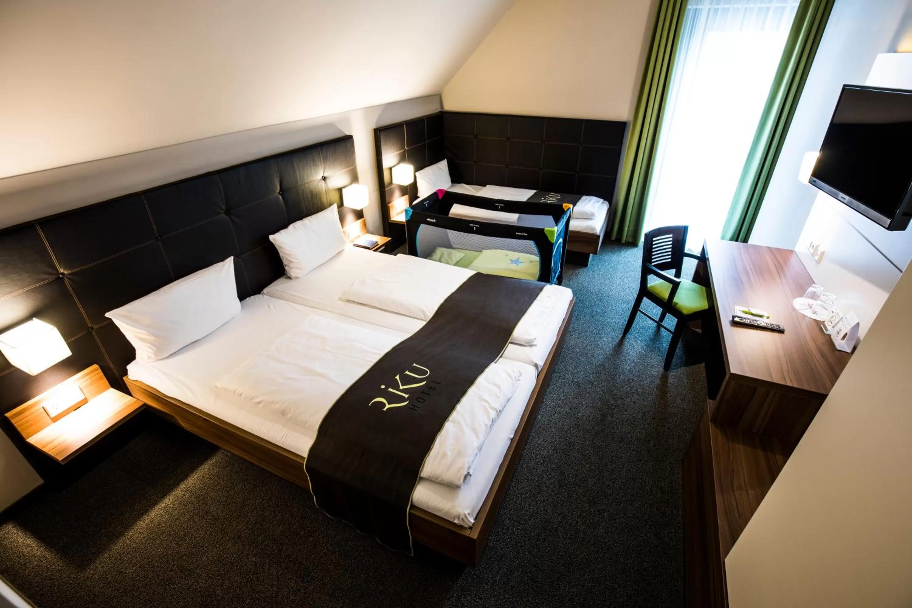 Photo of the whole room, Bed in RiKu HOTEL Weißenhorn
