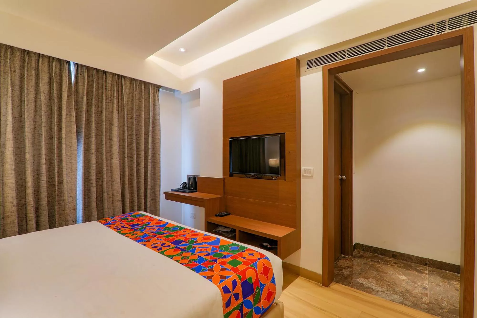 Bed in FabHotel Aurelia Grand