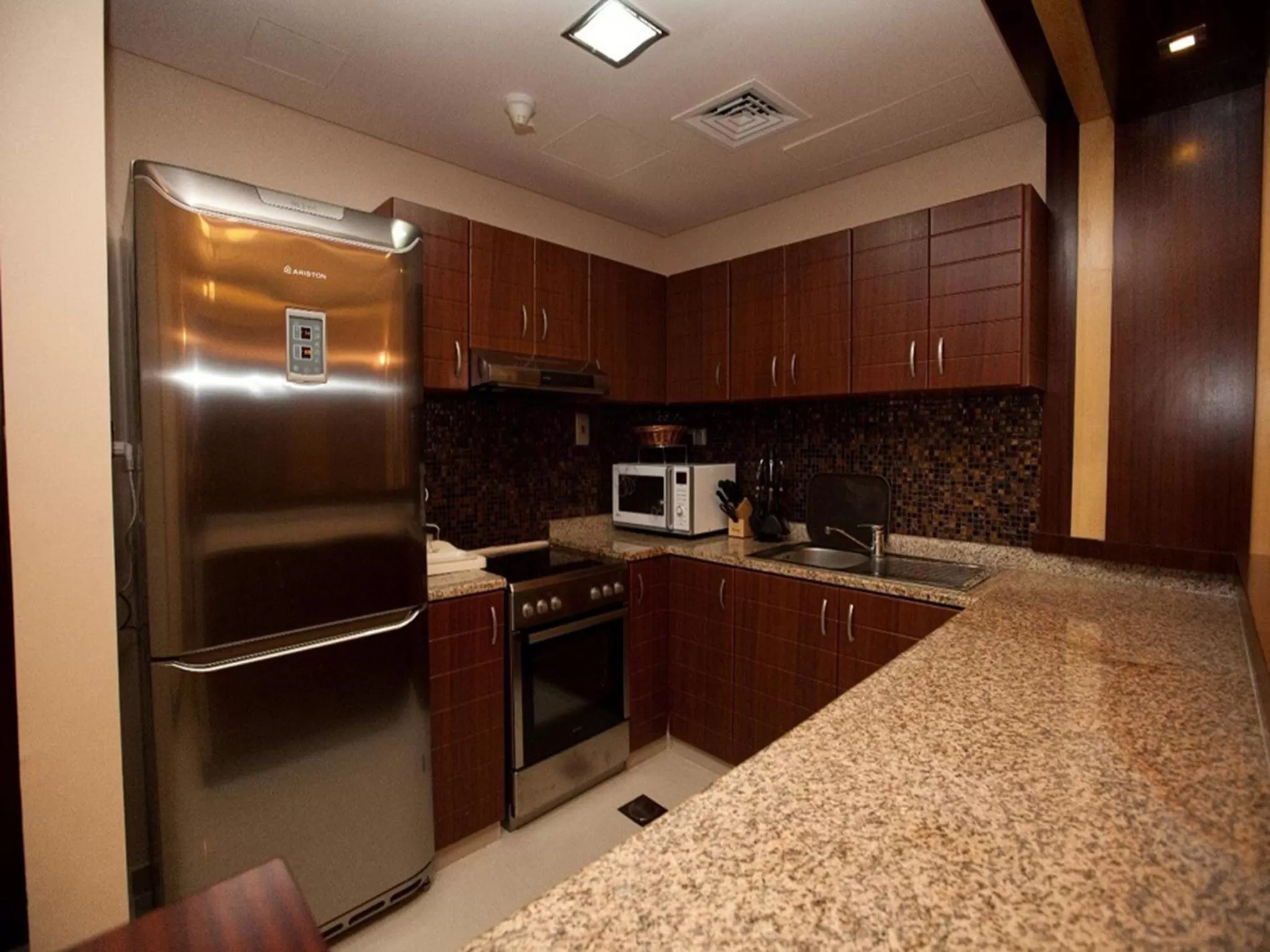 Kitchen or kitchenette in Xclusive Maples Hotel Apartment