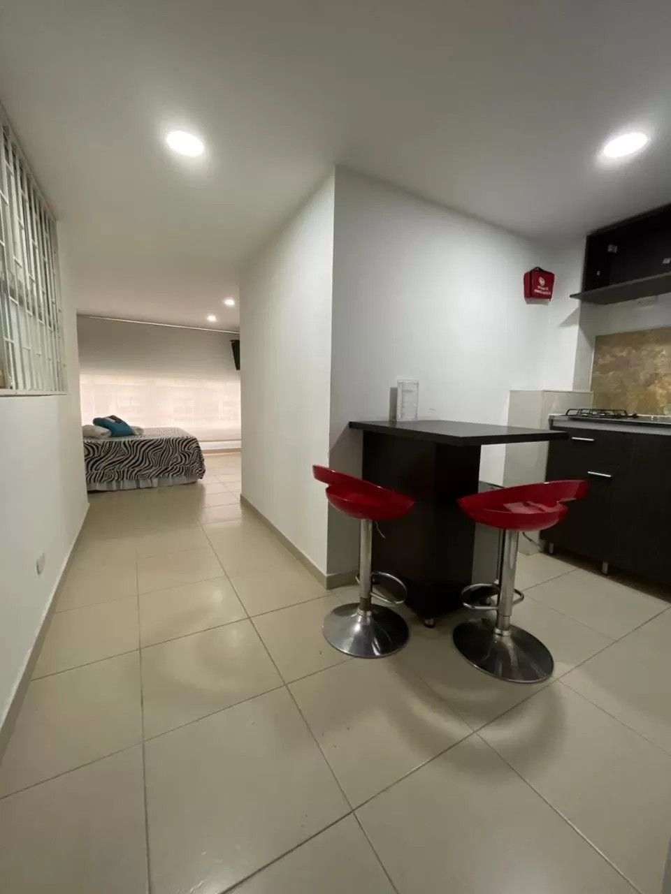 Photo of the whole room in Lindos apartaestudios y habitaciones en Ibague