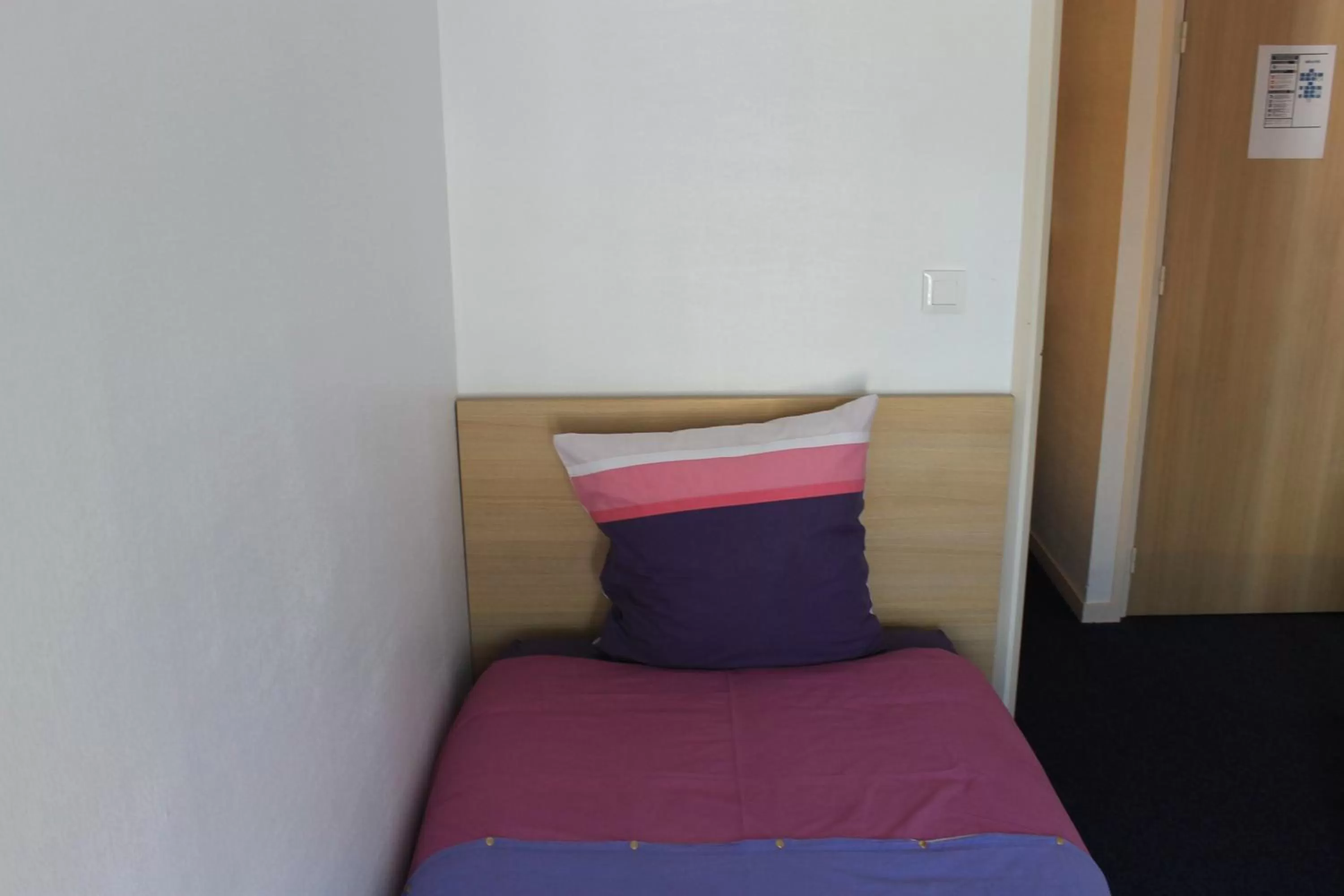 Bed in Hôtel du lion d'or