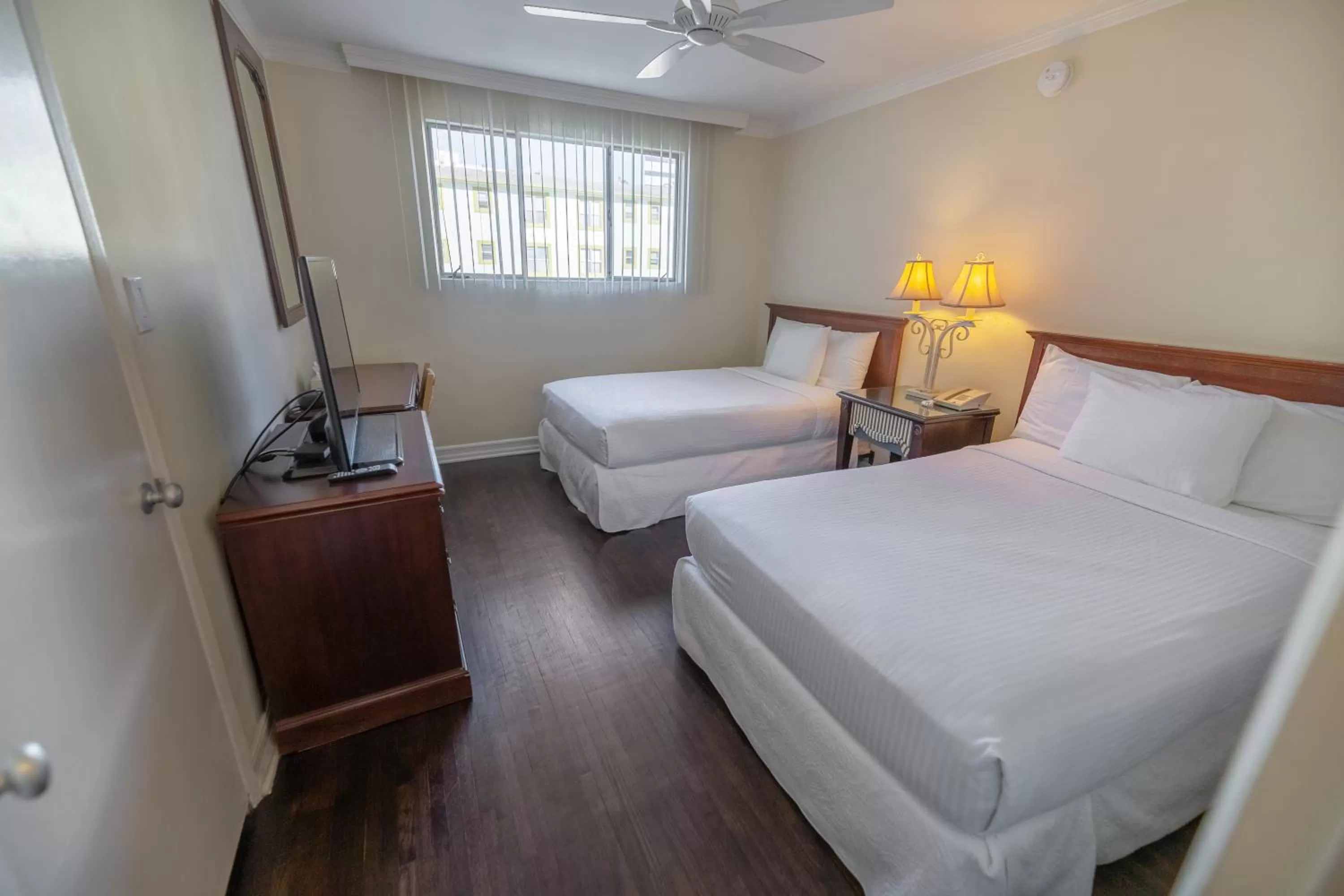 Bed in Cal Mar Hotel Suites