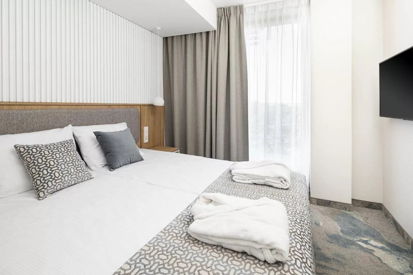 Bed in Maloves Resort & Spa