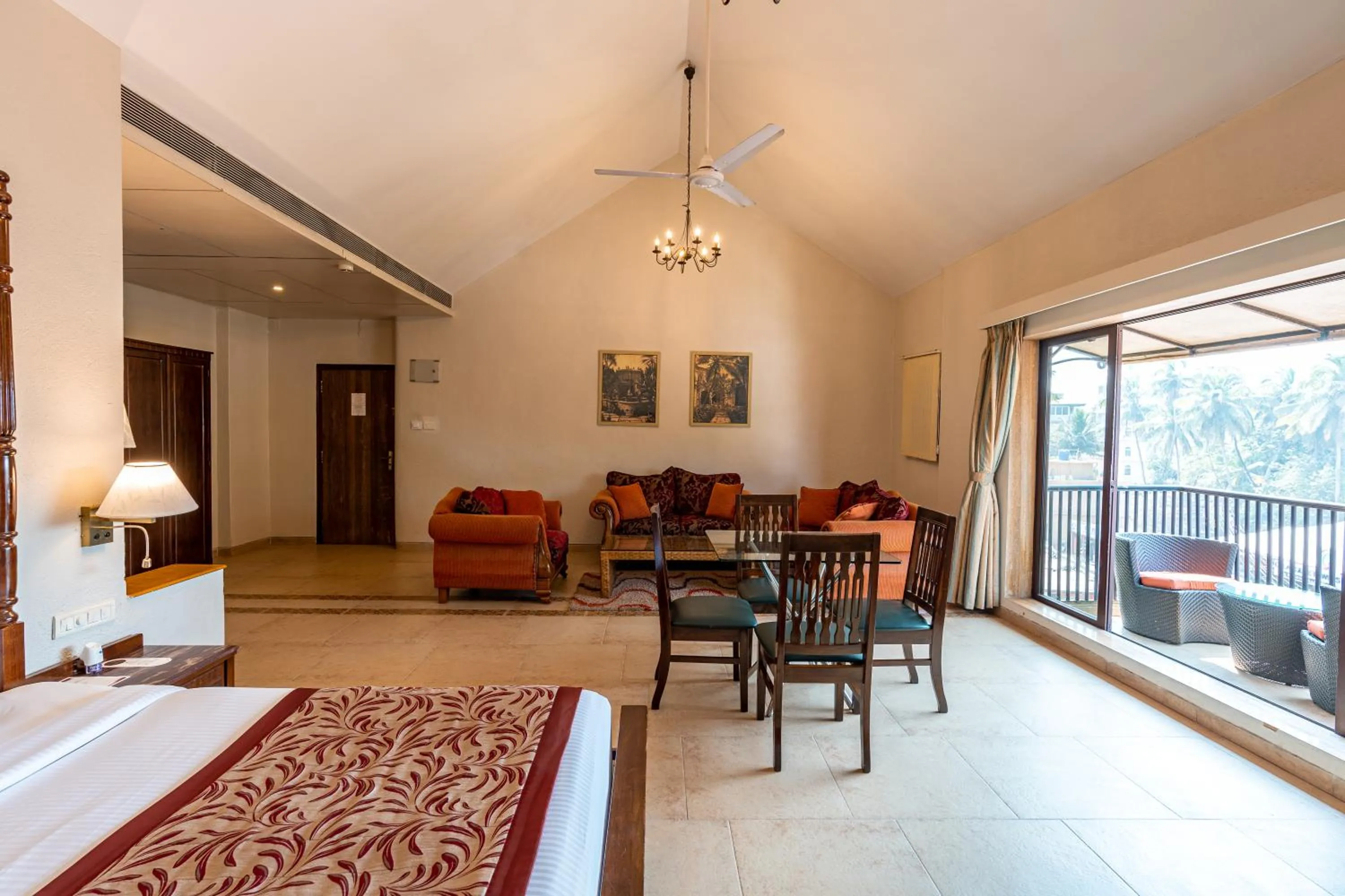 Living room, Bed in Neelam's The Grand Hotel Goa