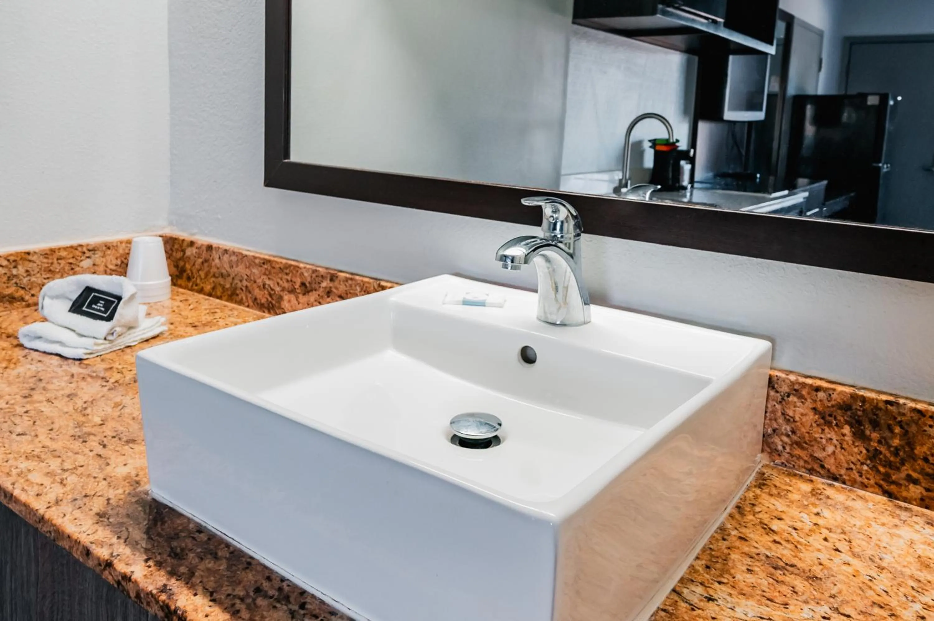 Bathroom in HomeTowne Studios by Red Roof San Antonio - SeaWorld Northwest