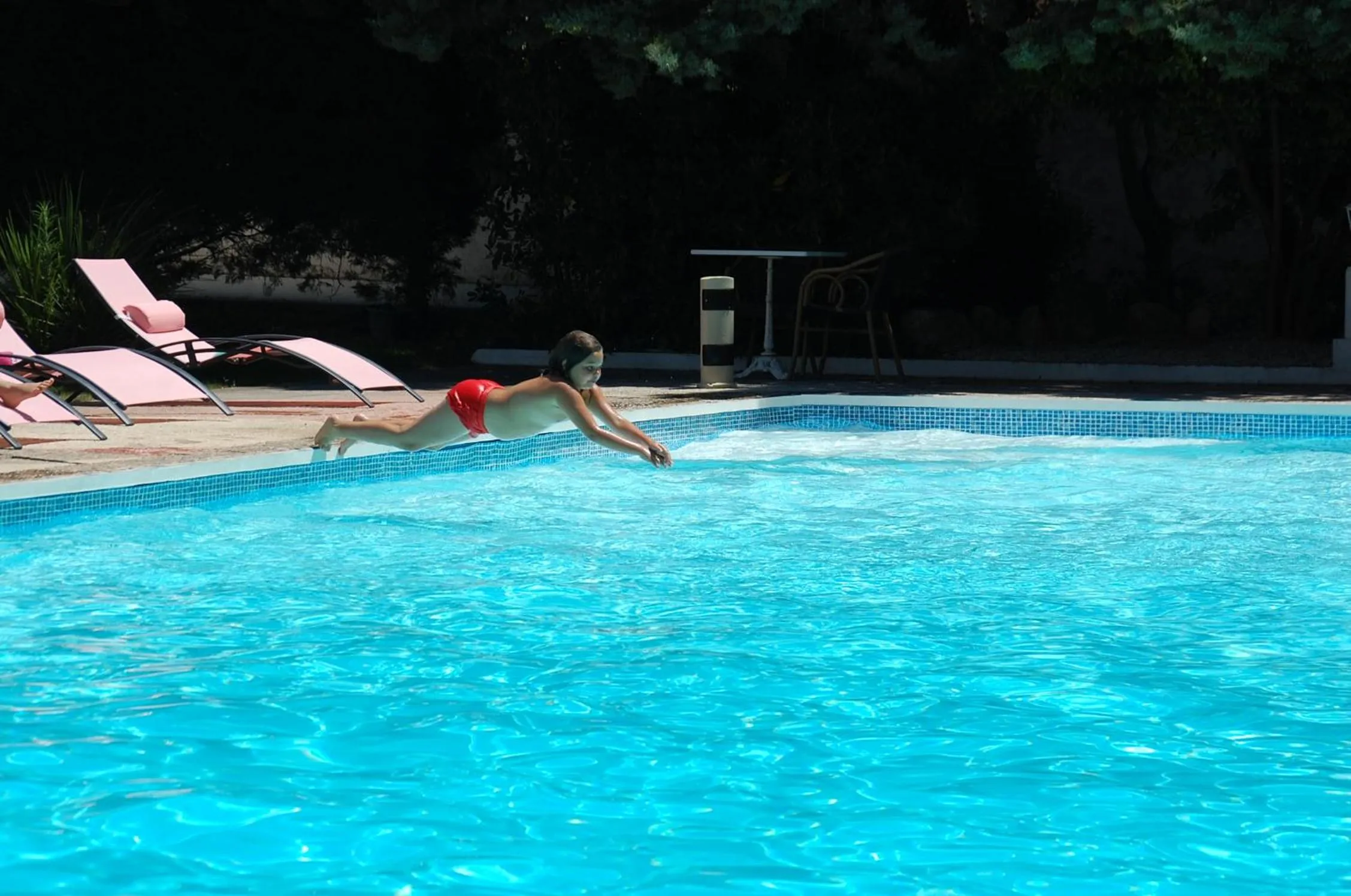 Swimming pool in Cit'Hotel Le Mirage