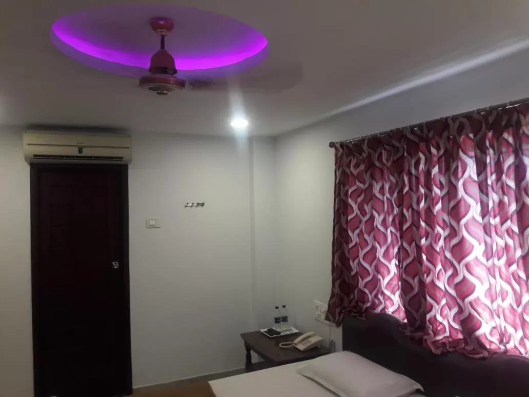 Bedroom, TV/Entertainment Center in Hotel Ramco Residency A/c