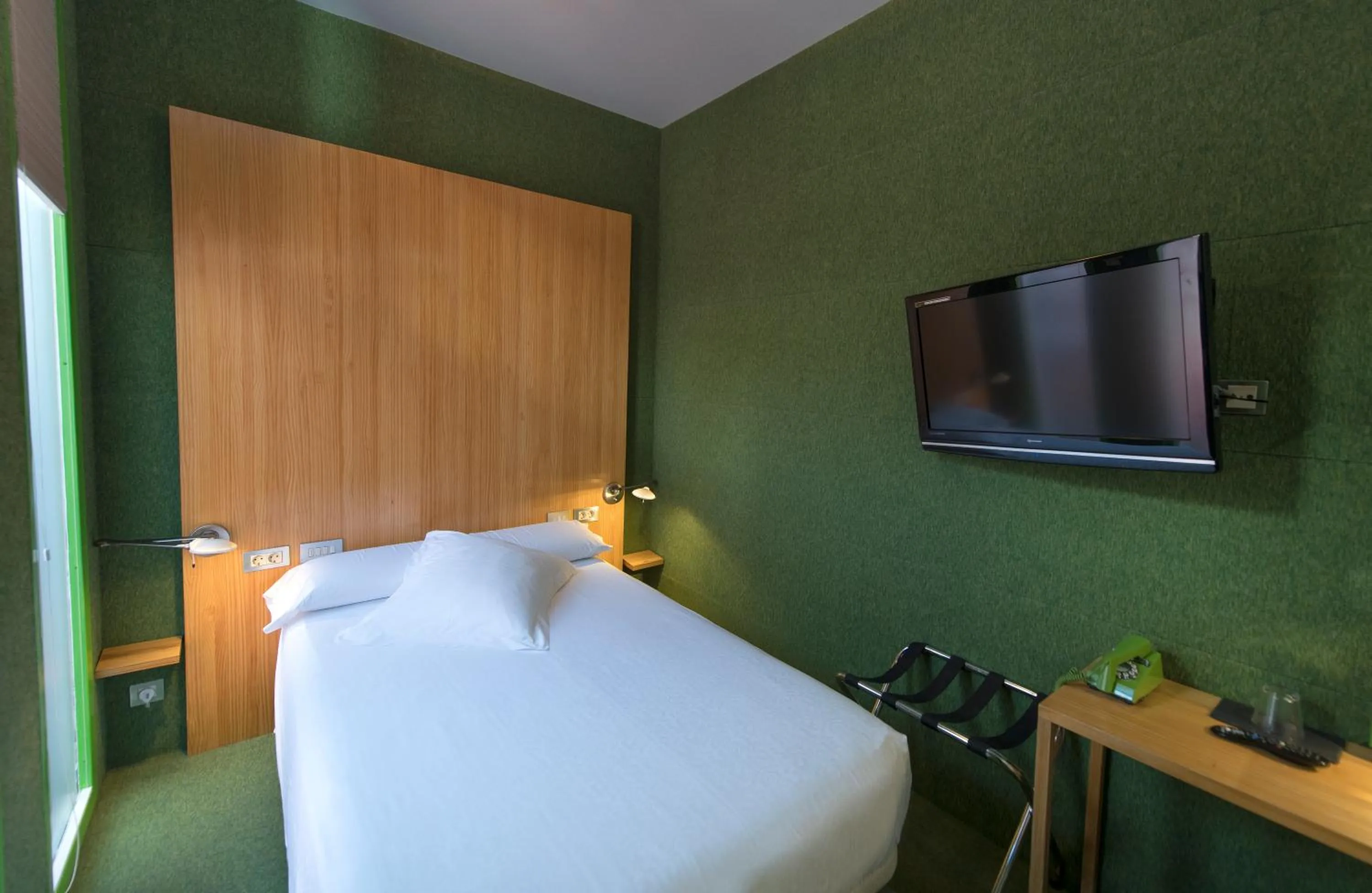 Bed in Posada del Dragón Boutique Hotel