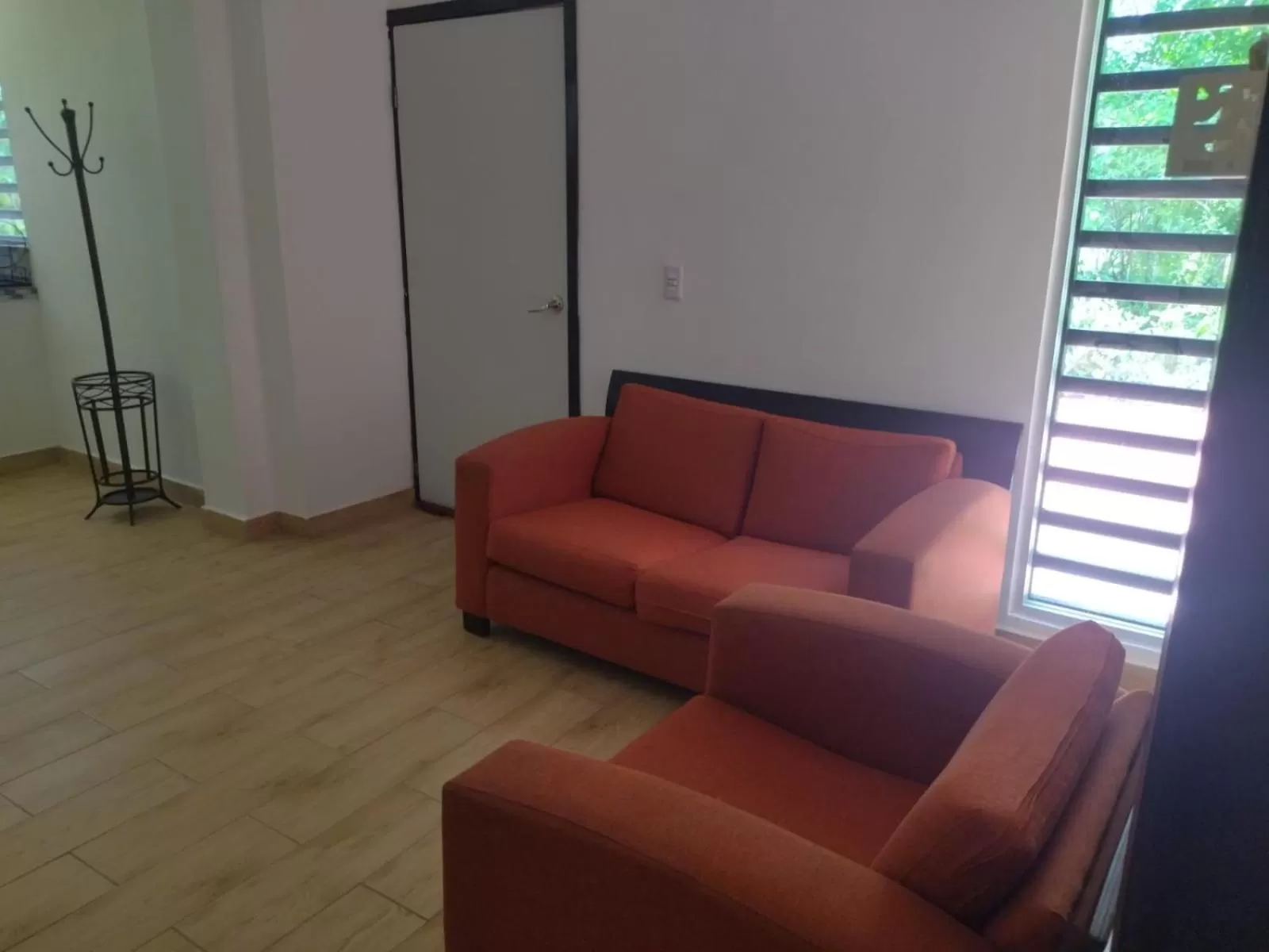 Communal lounge/ TV room in Garden Suites Comalcalco