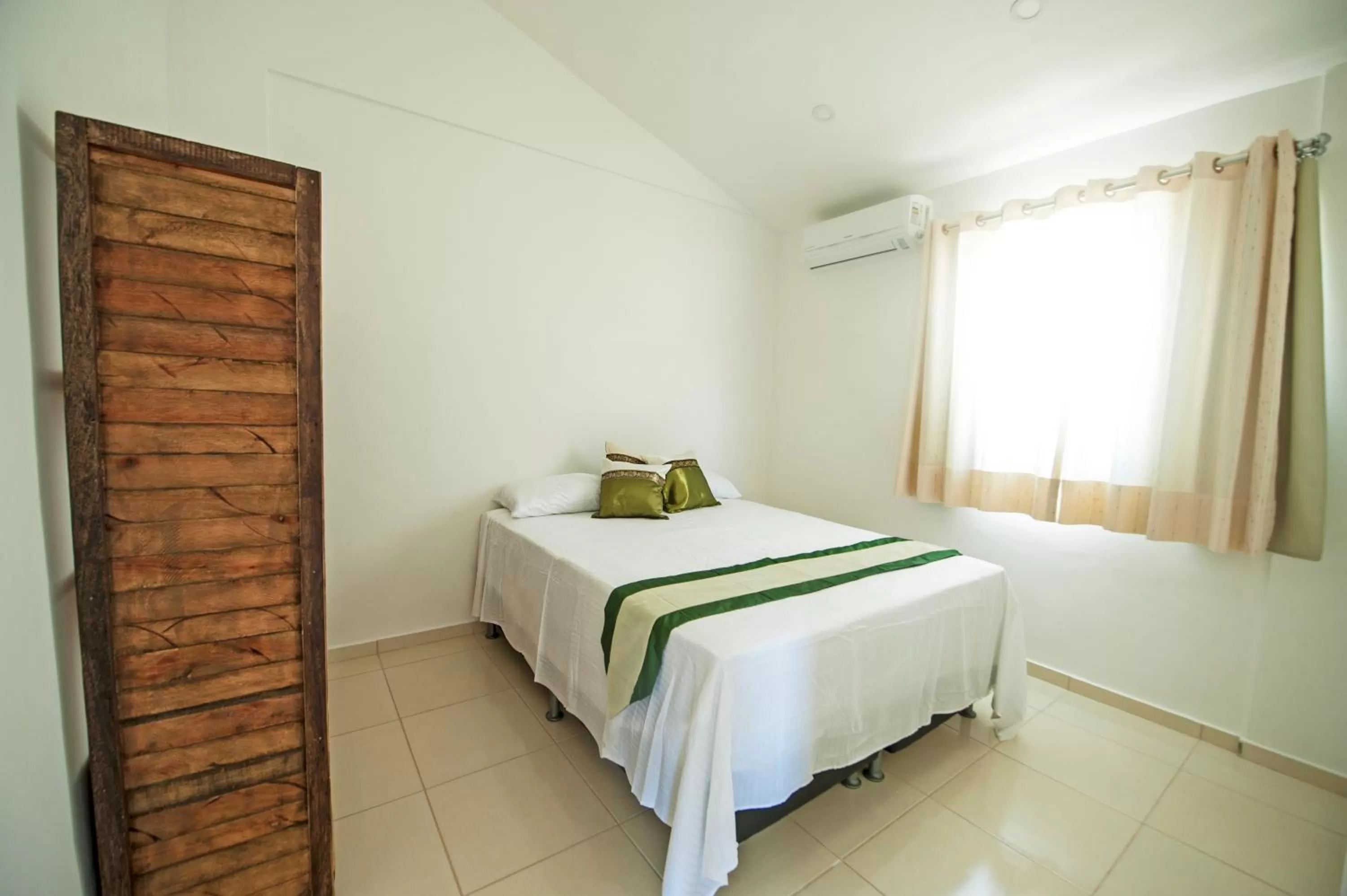 Bed in Manga Verde Beach Residence