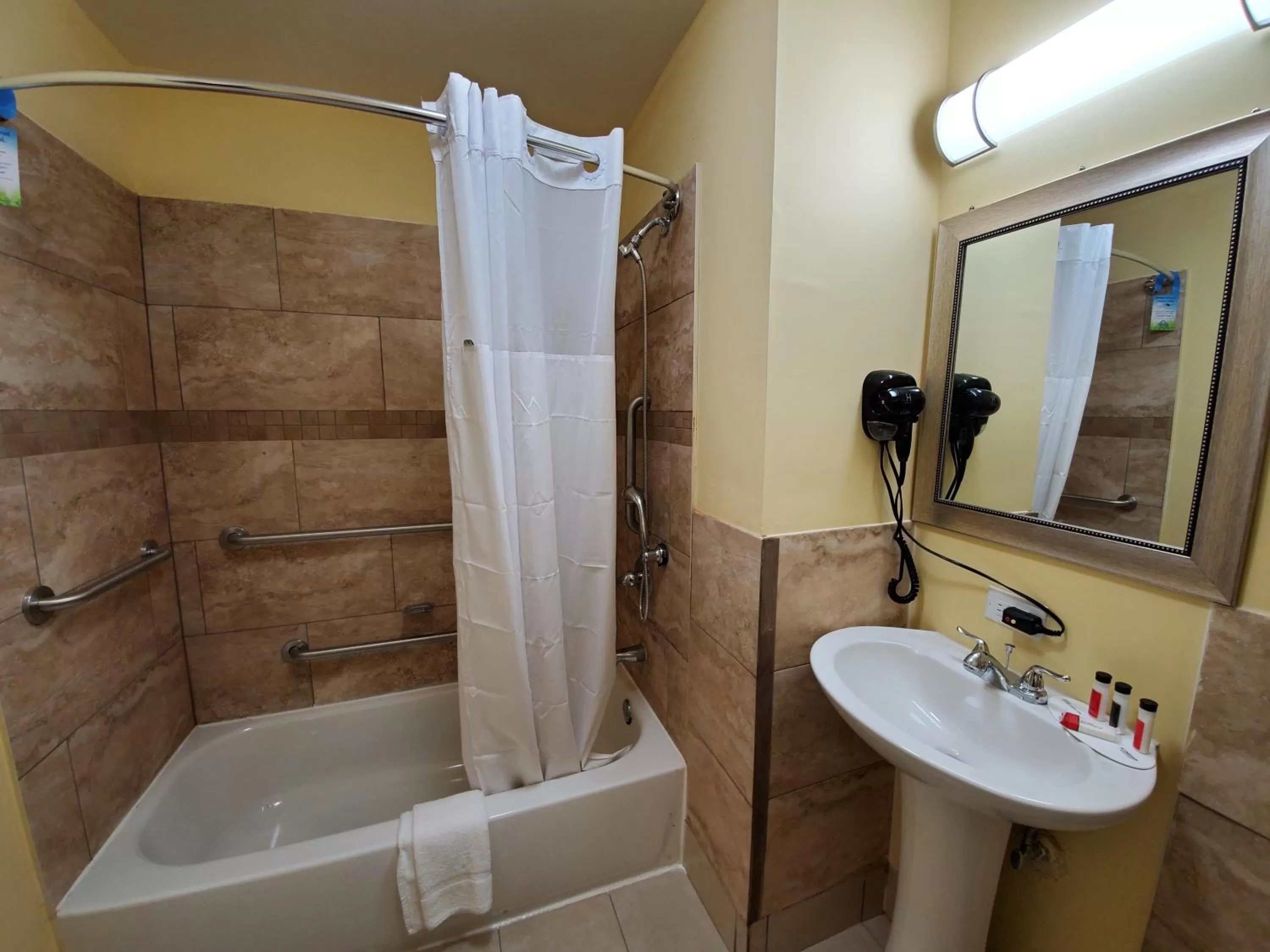 Bathroom in Days Inn by Wyndham Atlanta/Southlake/Morrow