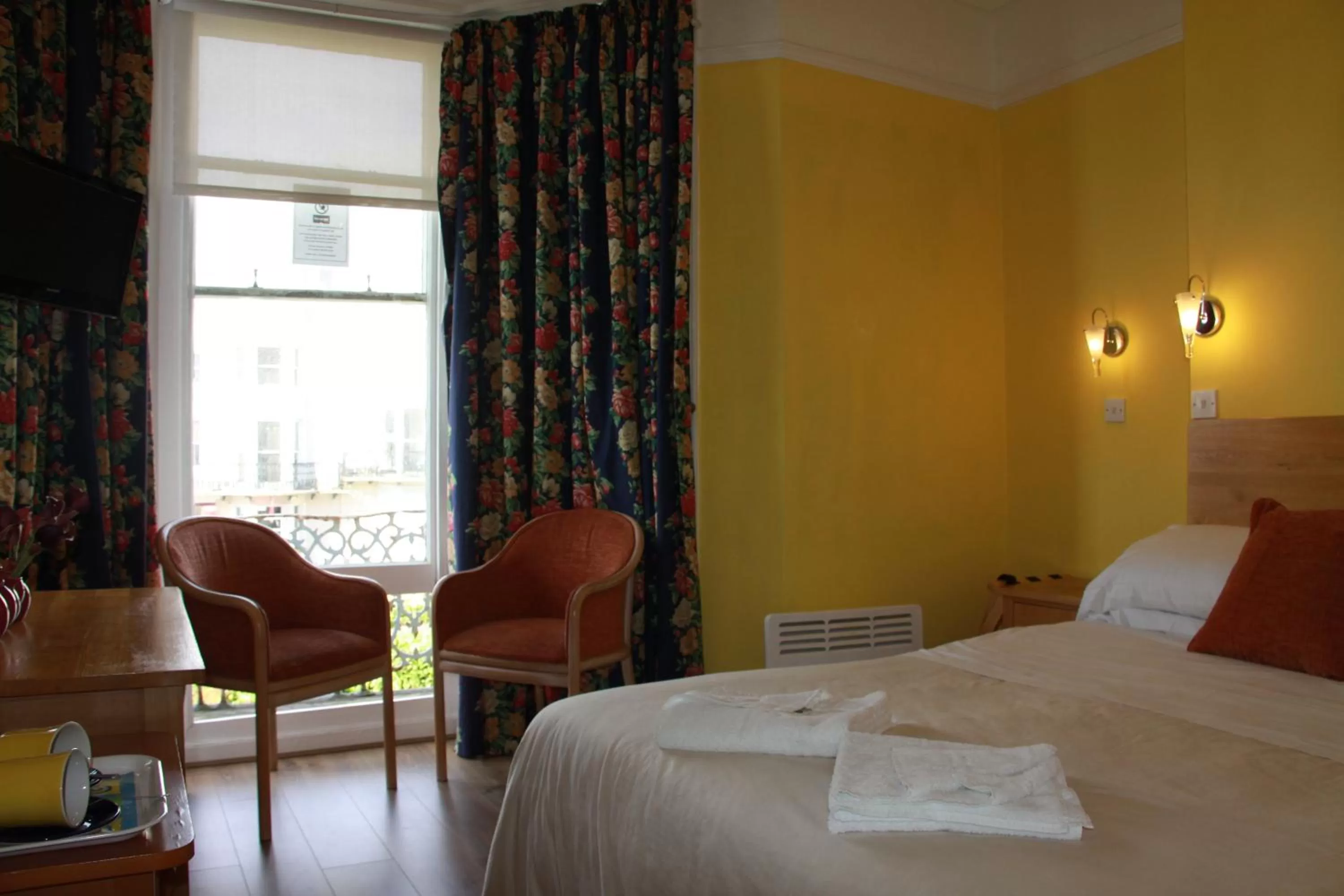 Bed in Ambassador Hotel