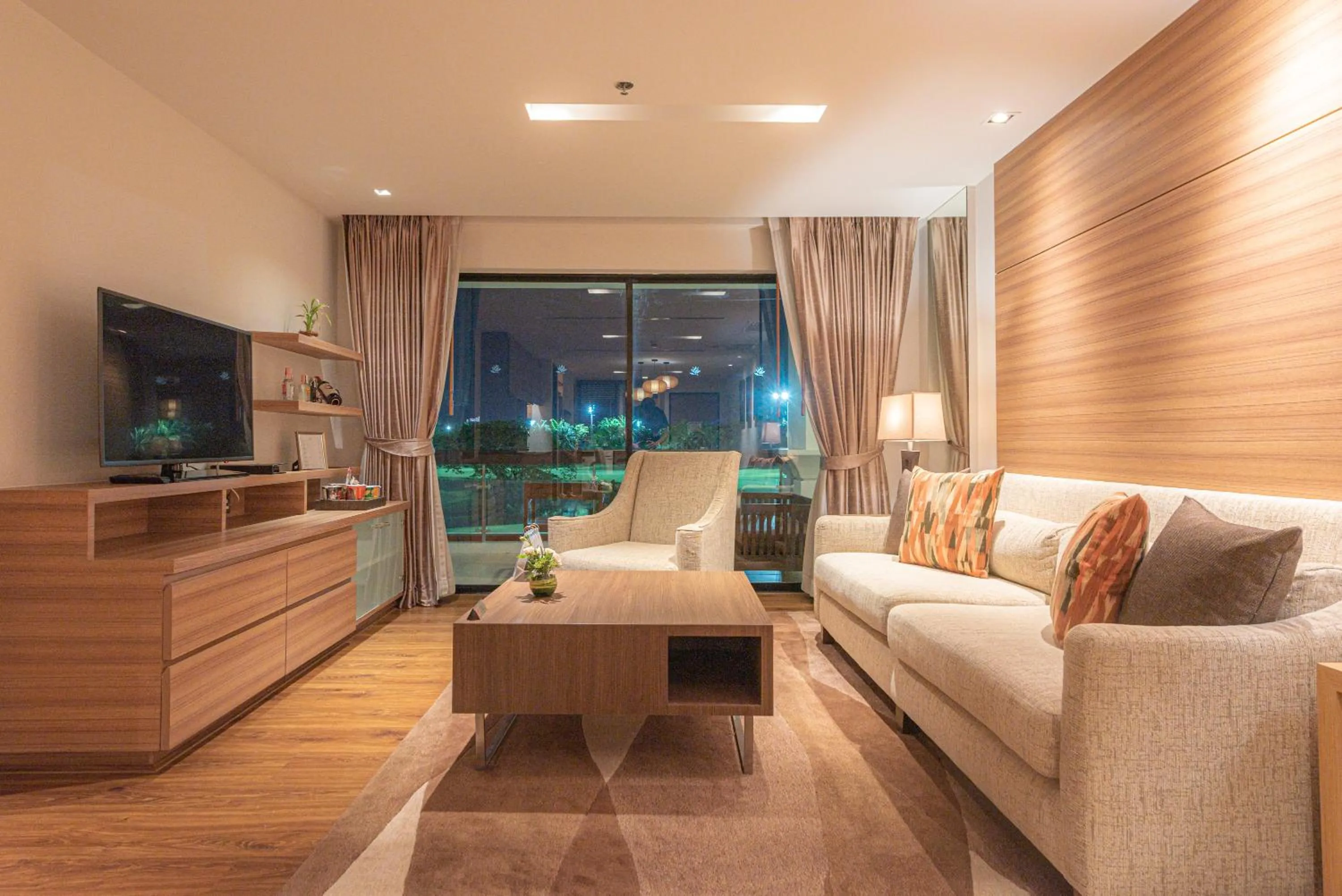 Living room in Summit Windmill Golf Suite Hotel at Suvarnabhumi