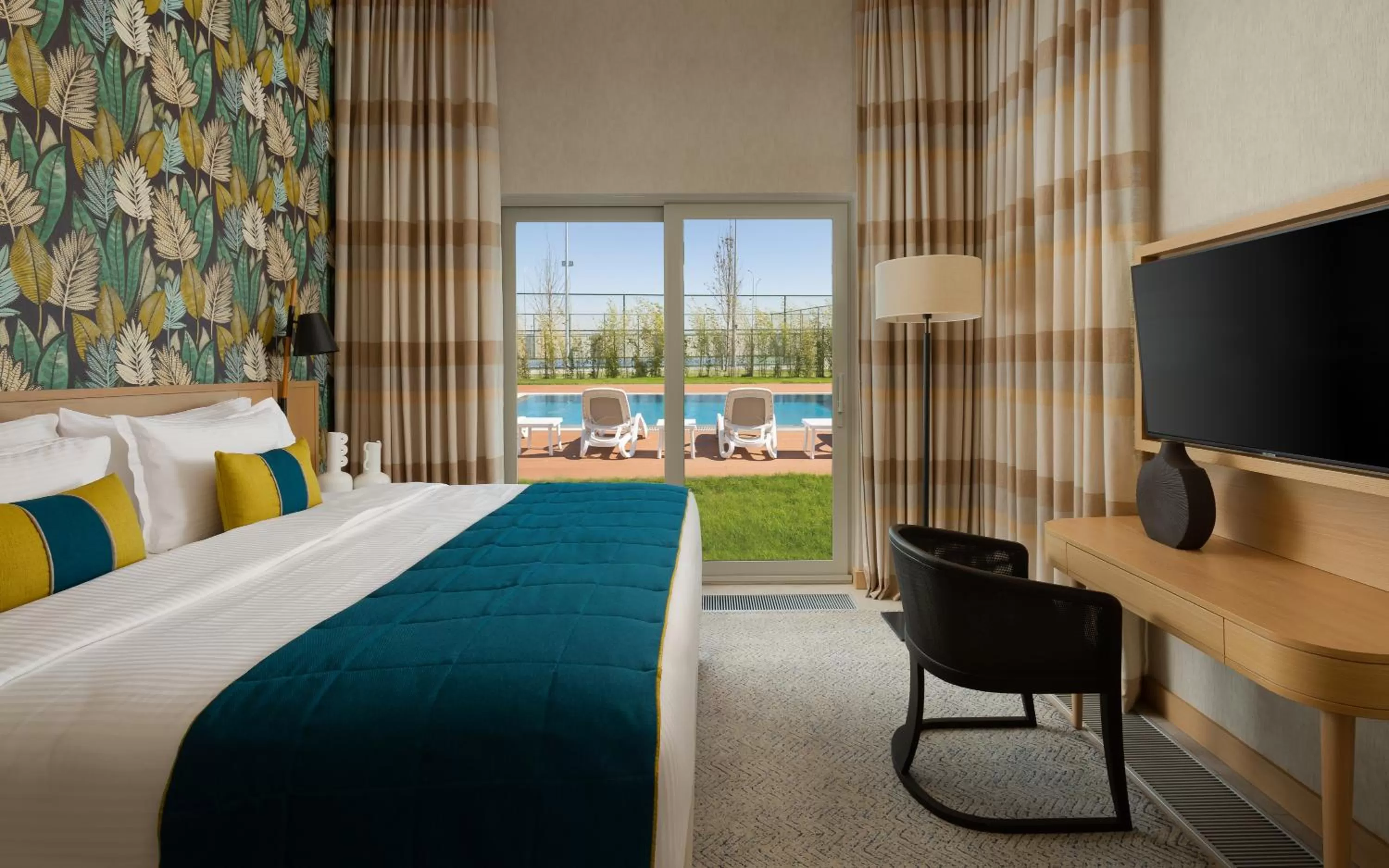 Photo of the whole room, Bed in Rixos Water World Aktau - Theme Park Free Access