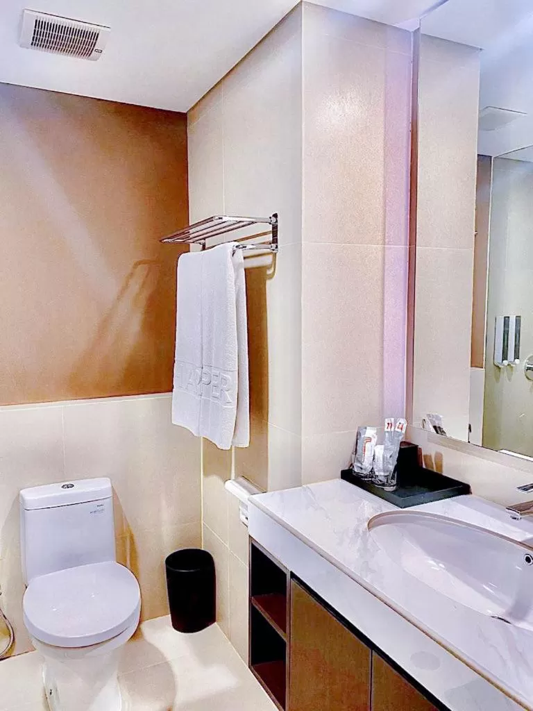 Bathroom in Harper Palembang by ASTON