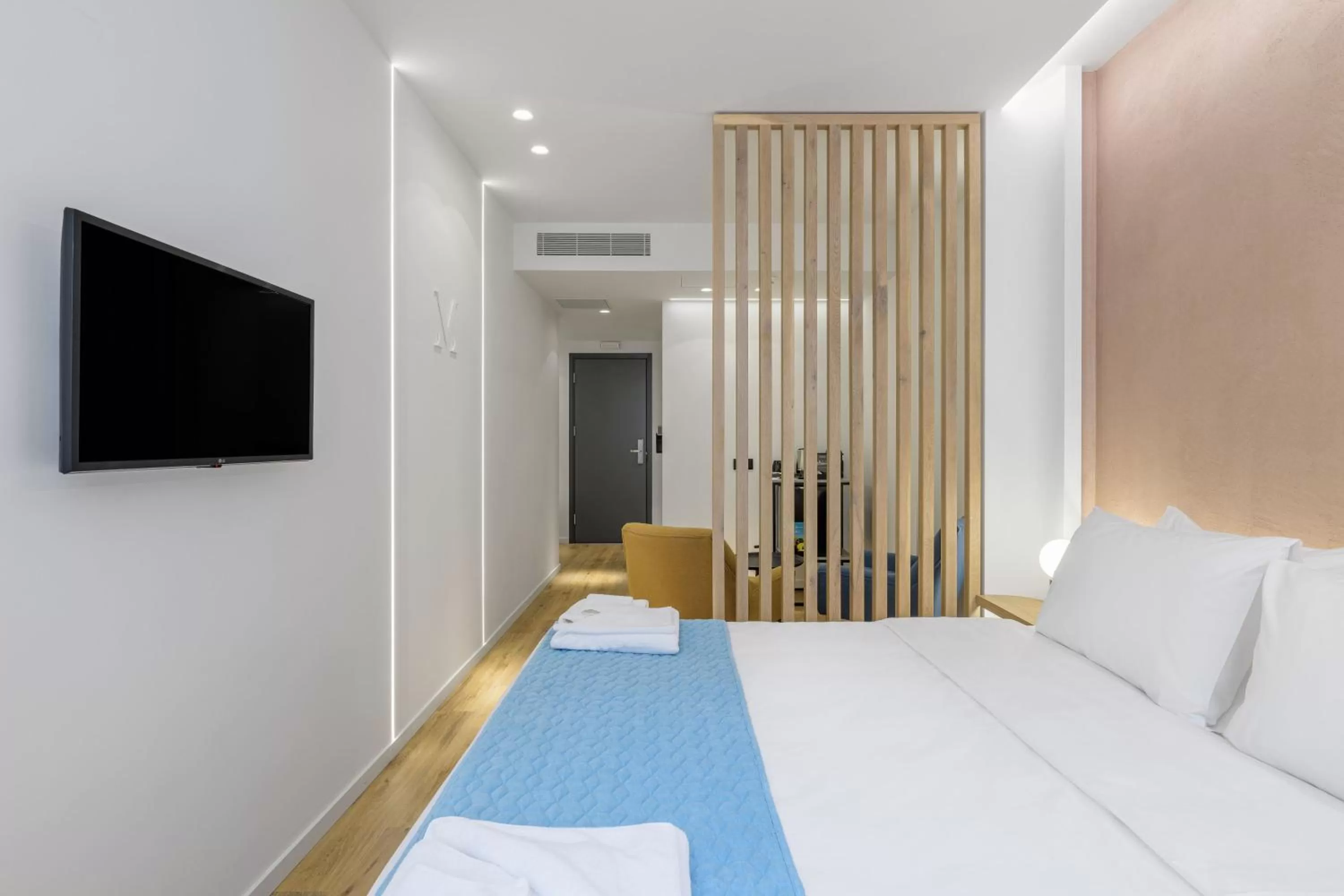 Bed in Acropolis Magenta Luxury Suites