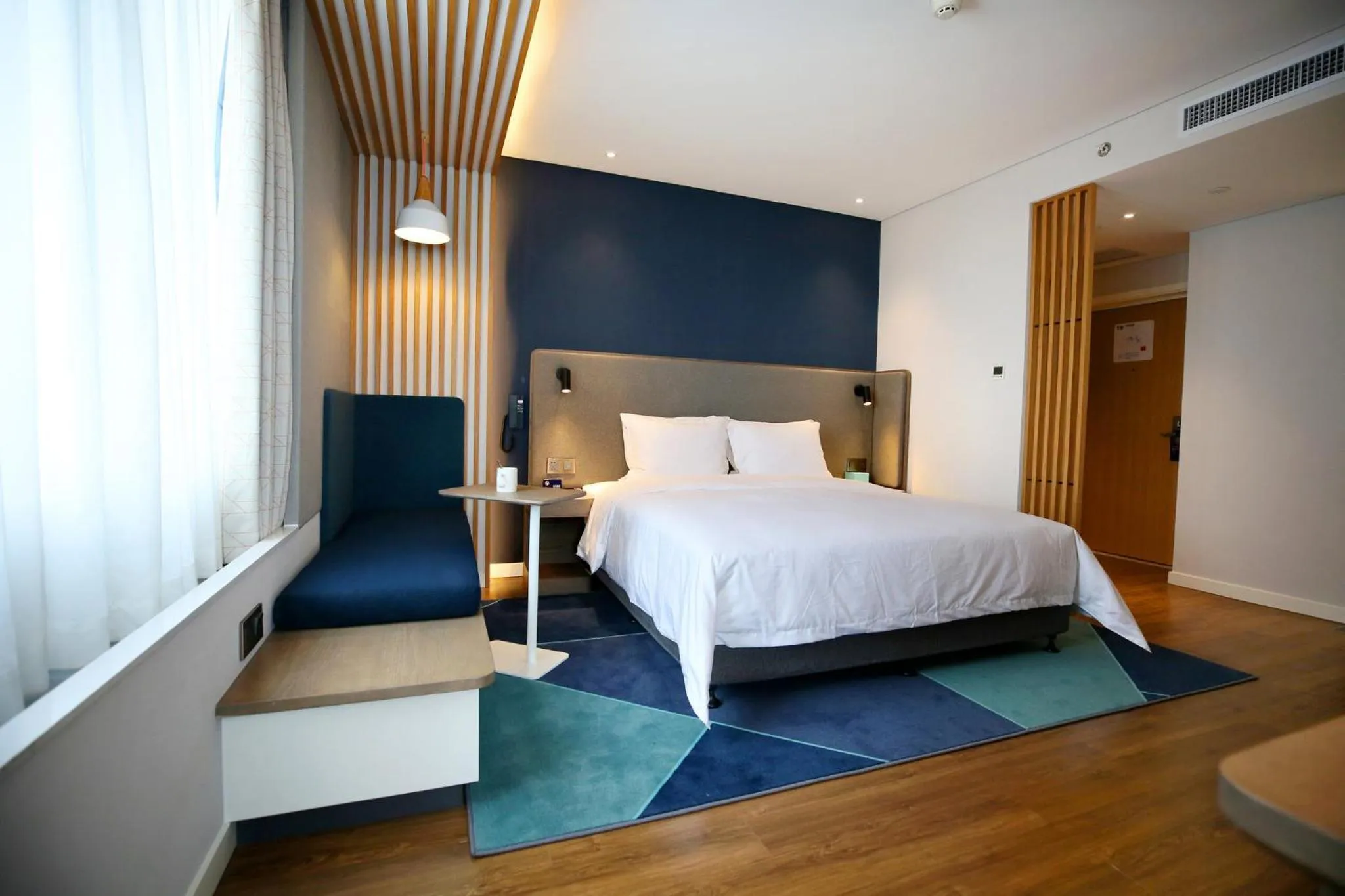Photo of the whole room, Bed in Holiday Inn Express Chengdu North Railway Station by IHG - Near Panda Base, Near Chunxi Road Free laundromat