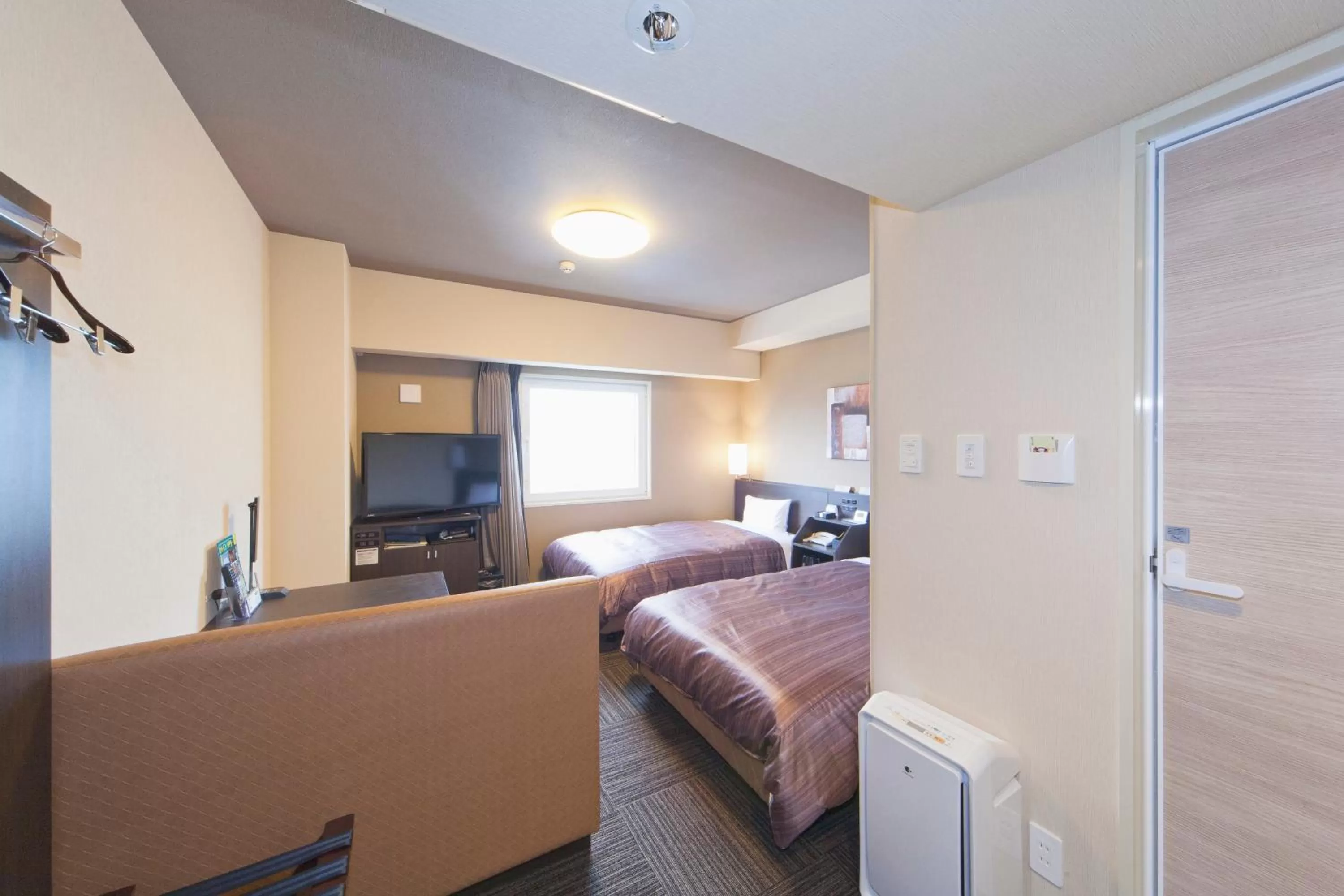 Photo of the whole room, Bed in Hotel Route-Inn Saiki Ekimae