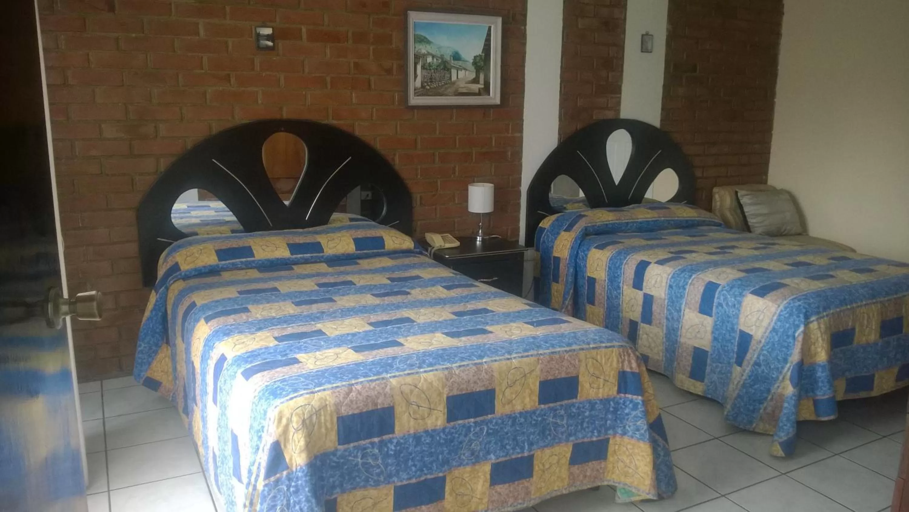 Photo of the whole room, Bed in Mariana's Petit Hotel