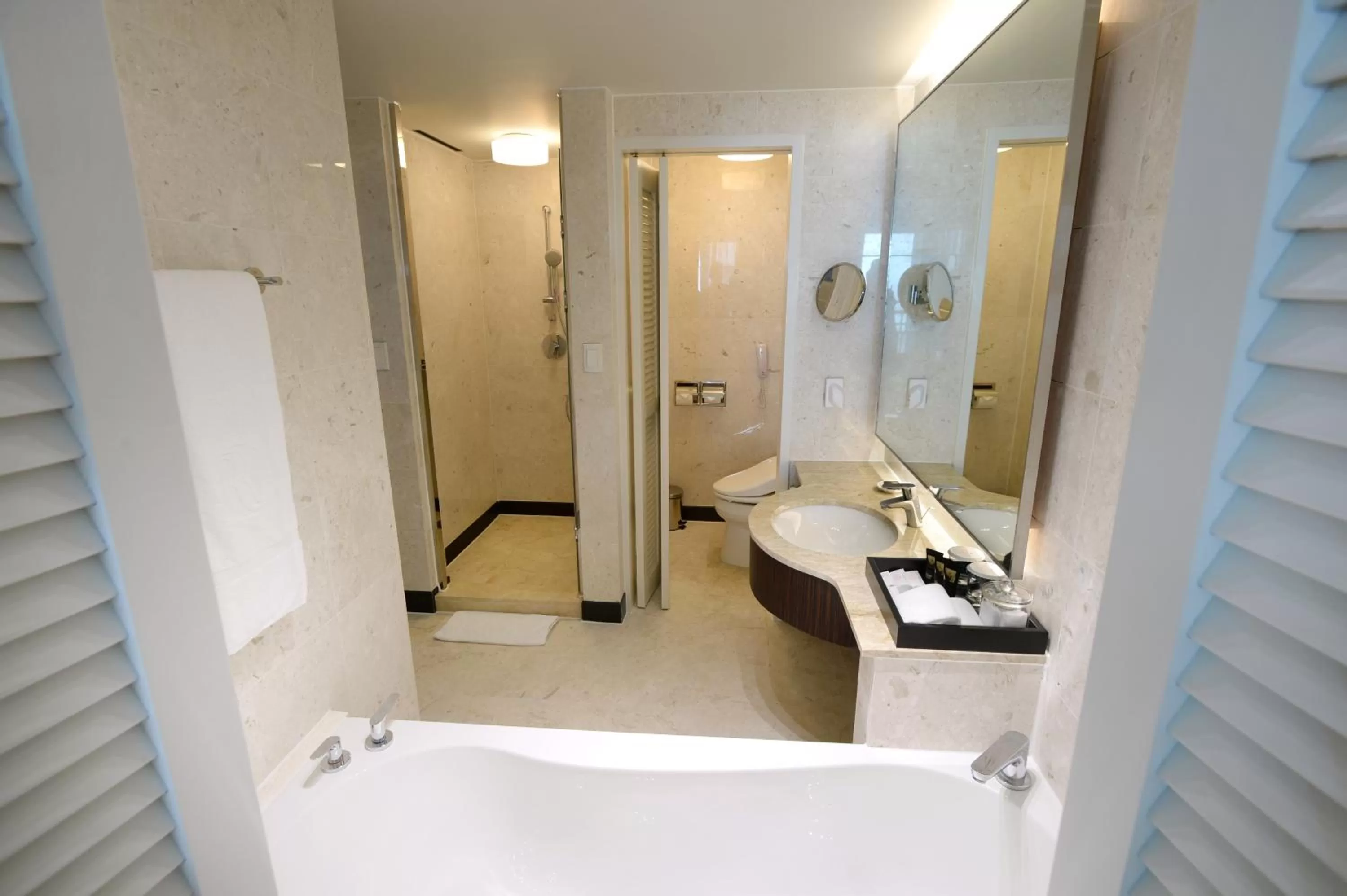 Shower in Ramada Plaza by Wyndham Jeju Ocean Front