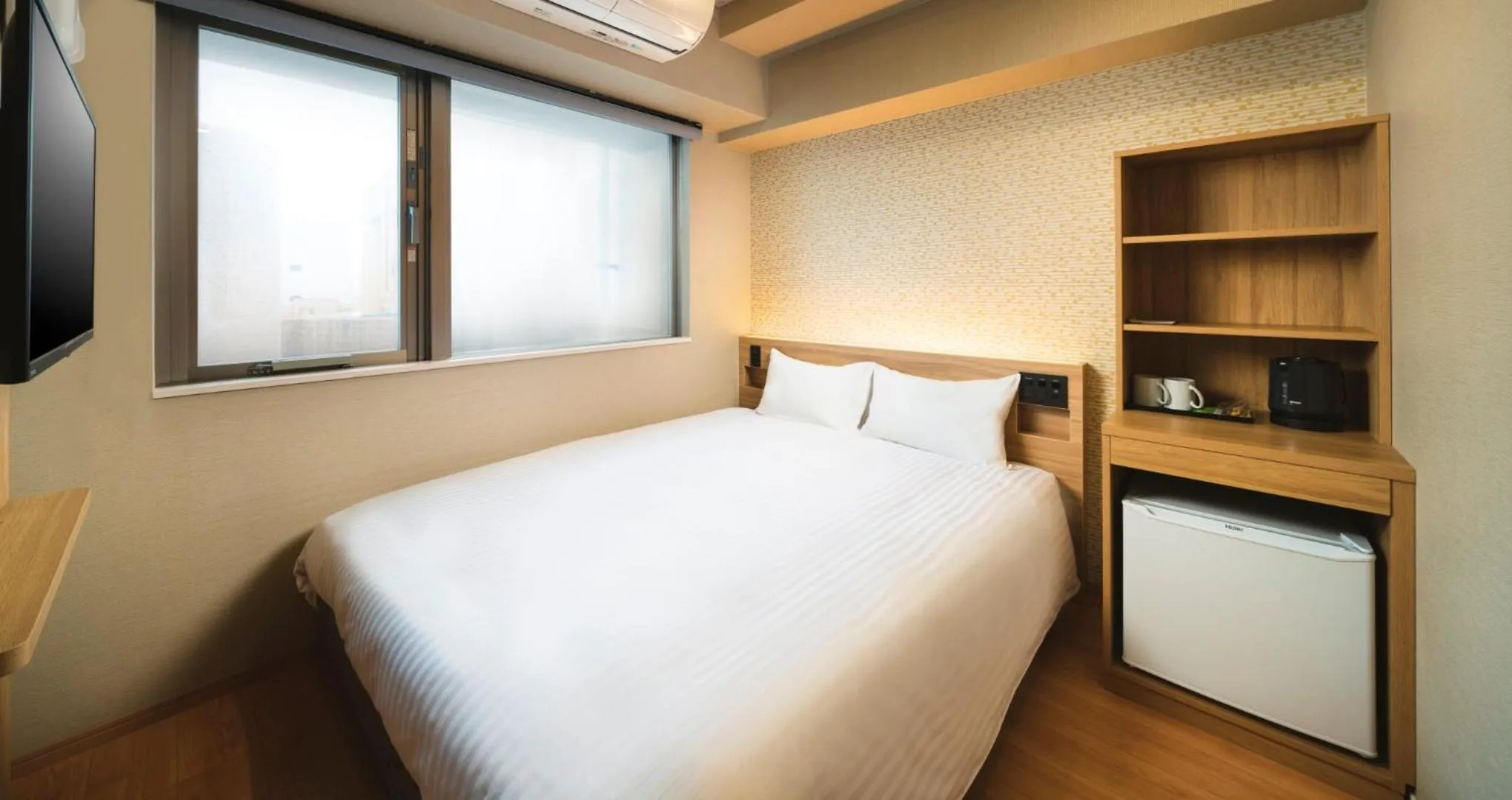 Bed in HOTEL SANSUI NAHA Ryukyu Onsen Naminoue-No-Yu