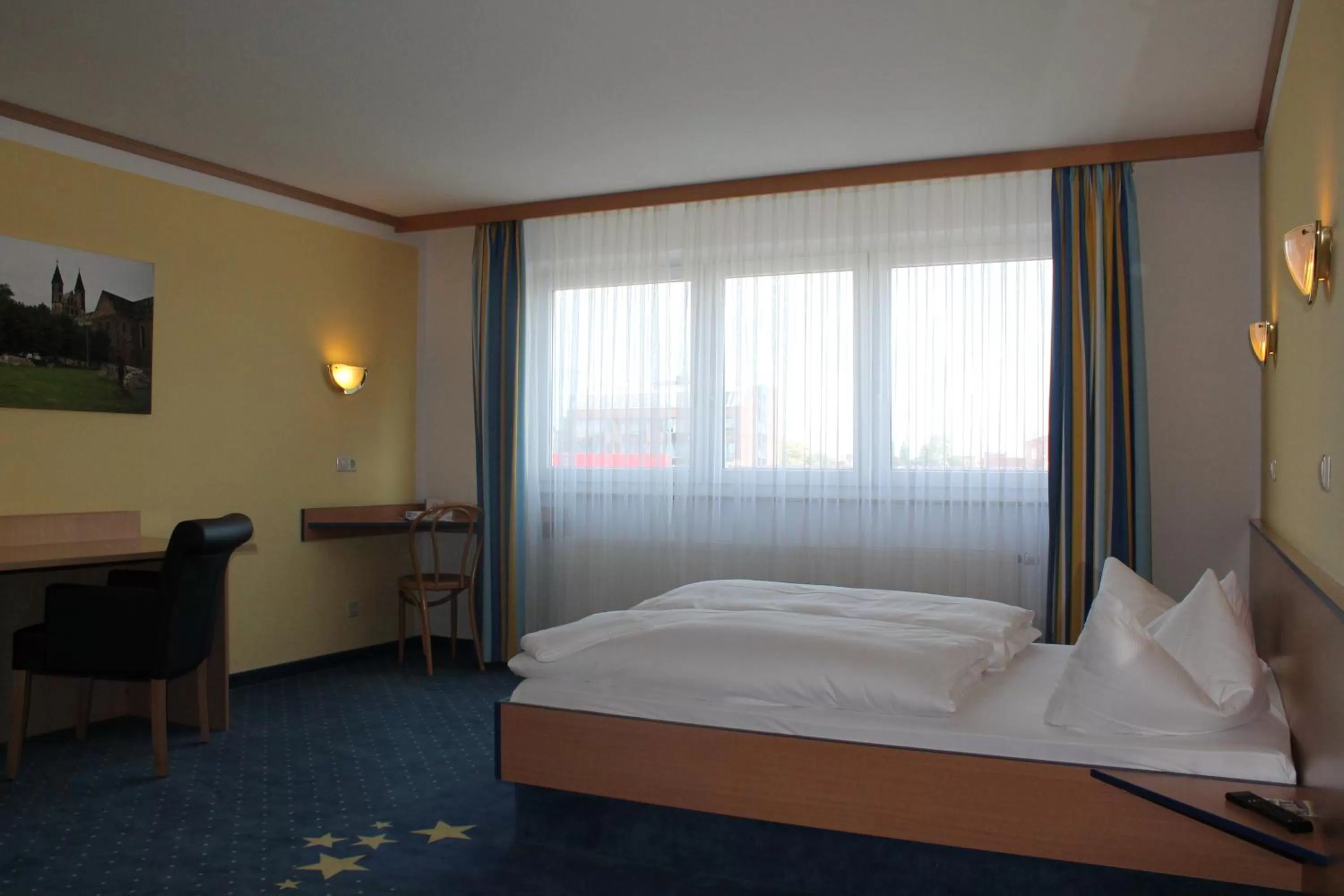 Decorative detail, Bed in Sleep & Go Hotel Magdeburg