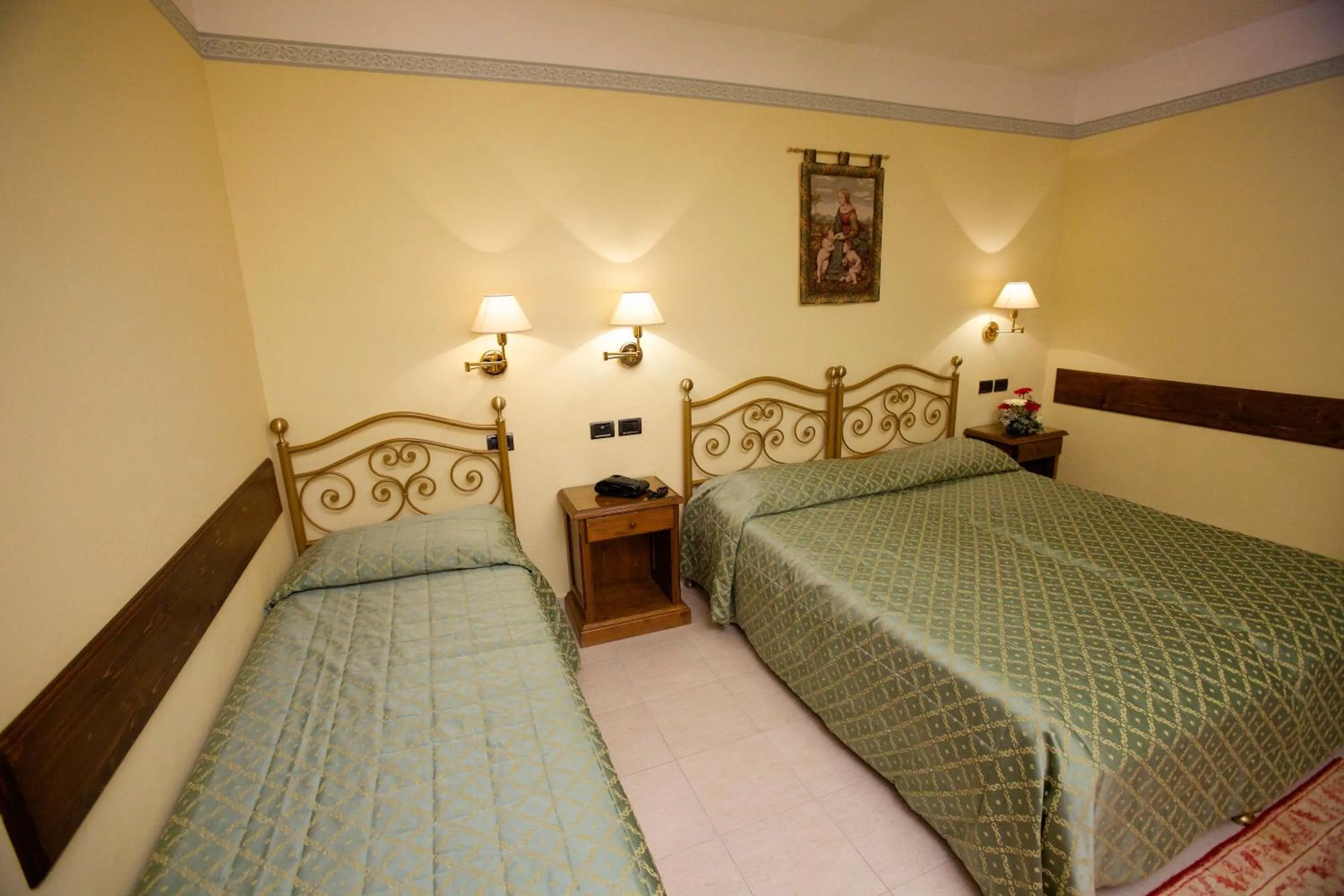 Bed in Campiglione Hotel