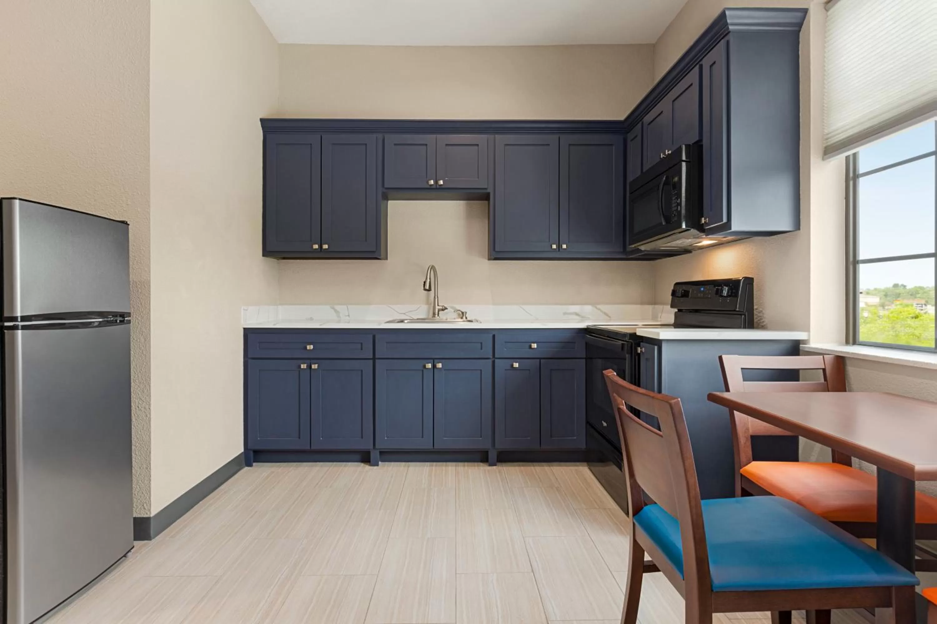Kitchen or kitchenette in Days Inn & Suites by Wyndham Greater Tomball