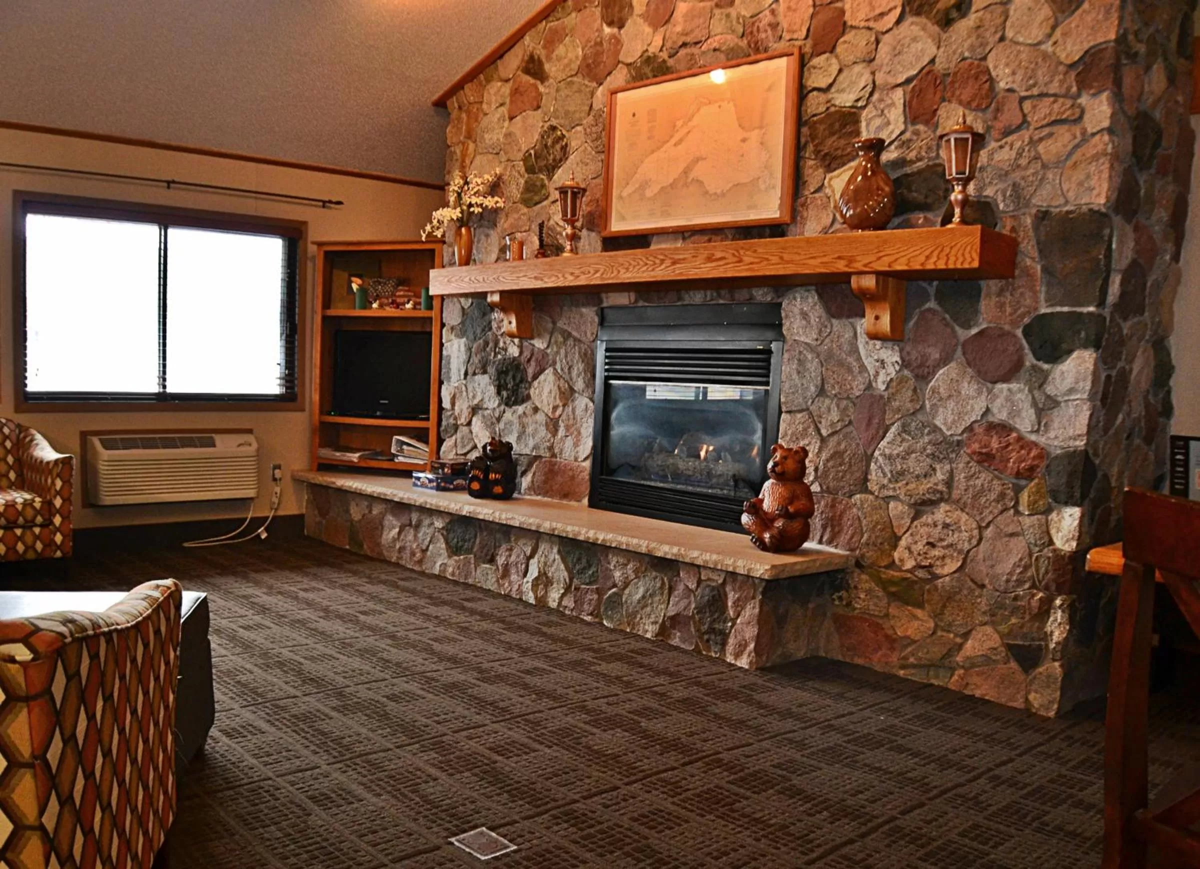 Living room in AmericInn by Wyndham Calumet