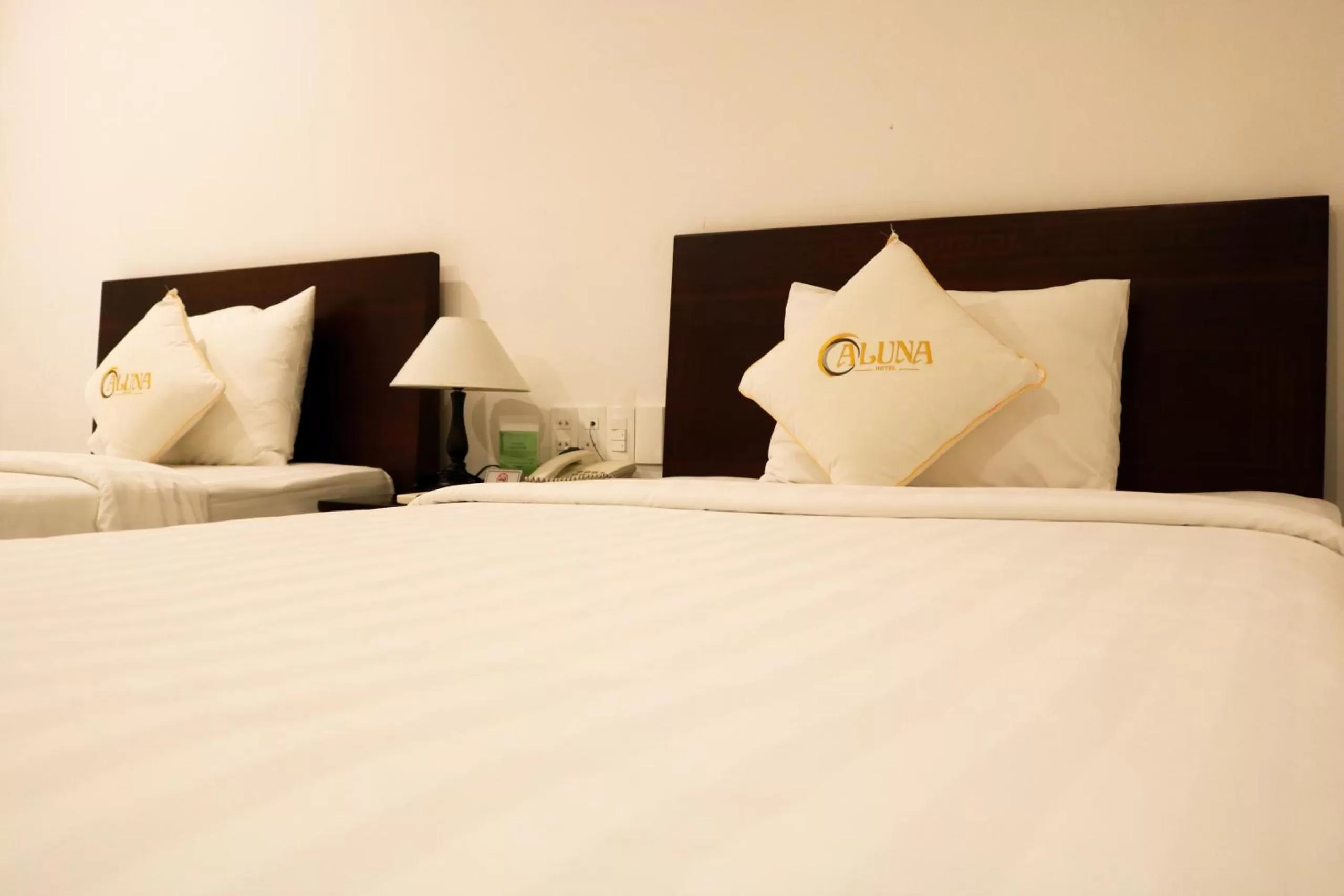 Bed in ALUNA Ben Thanh Hotel