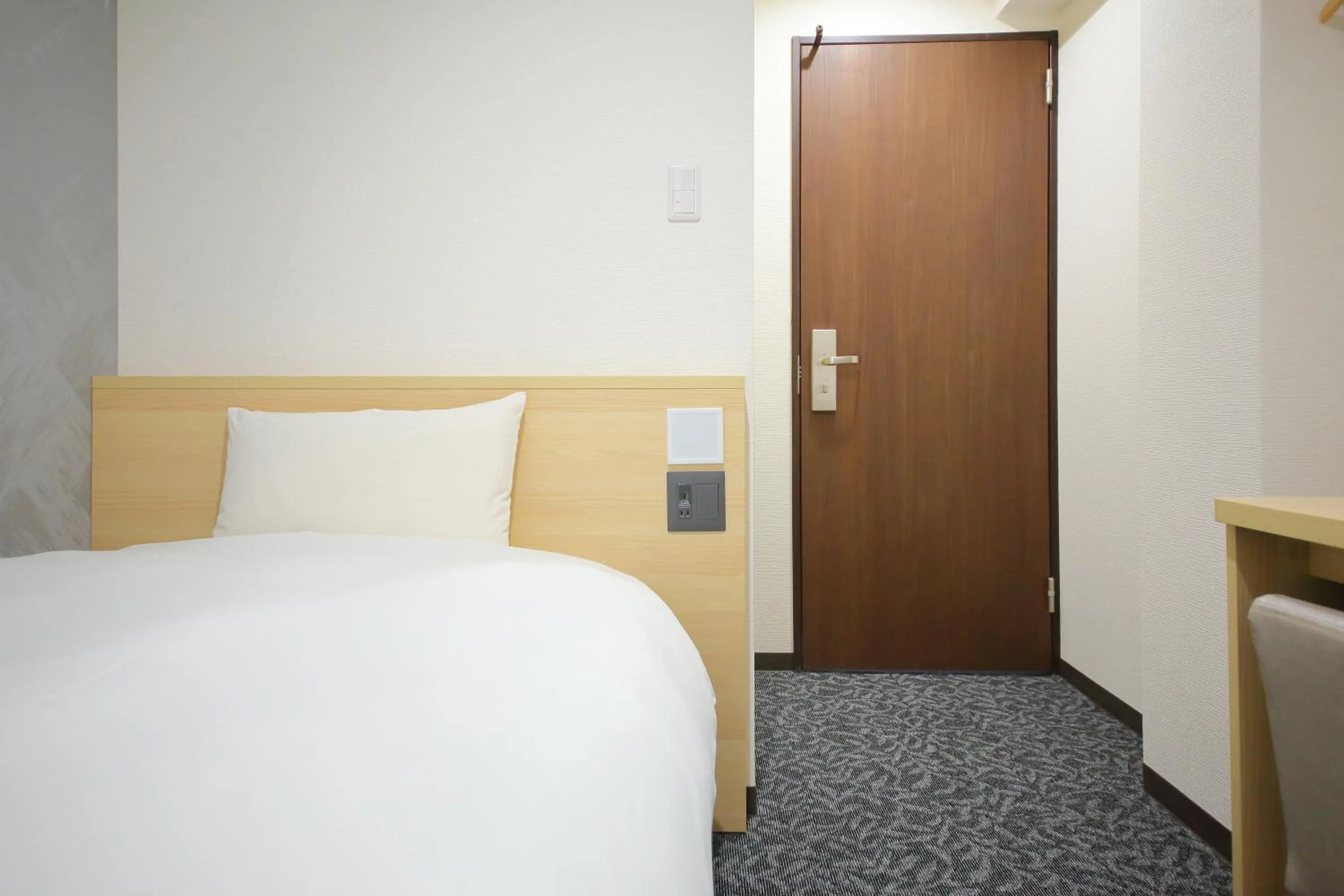 Bed in Hotel Shin-Imamiya