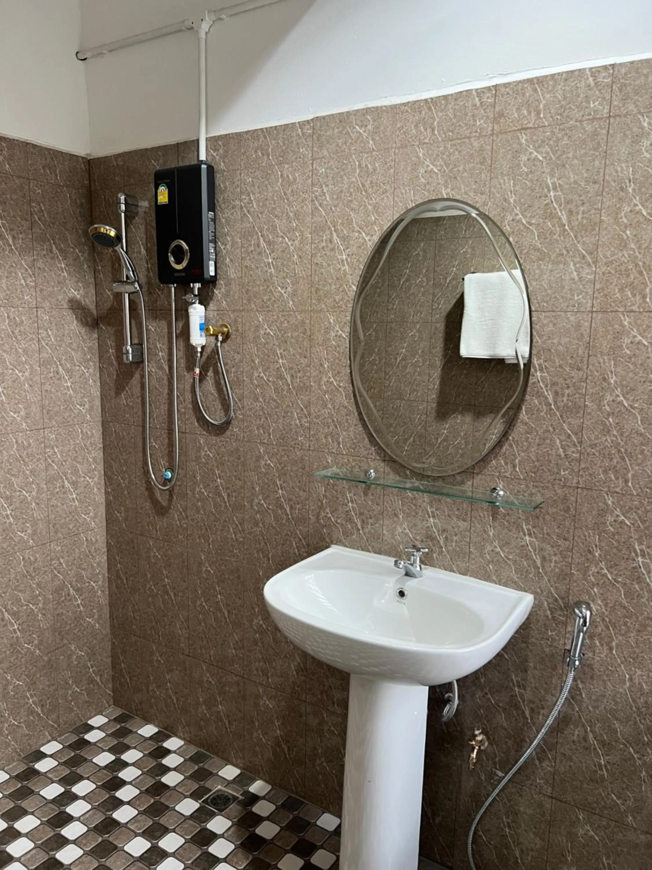 Shower in Mall Suites Hotel