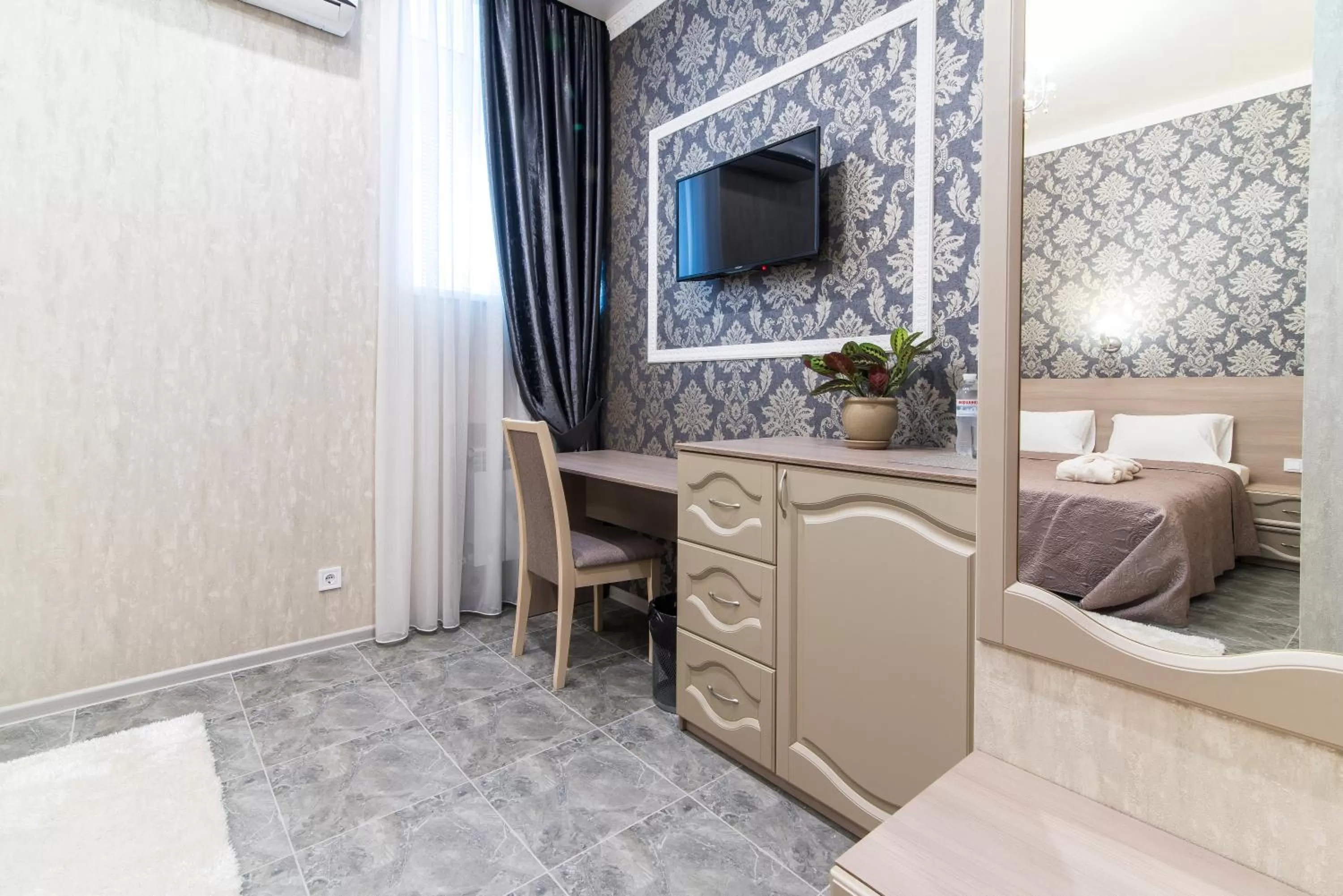 Communal lounge/ TV room, Bed in L.O.Y Family Hotel