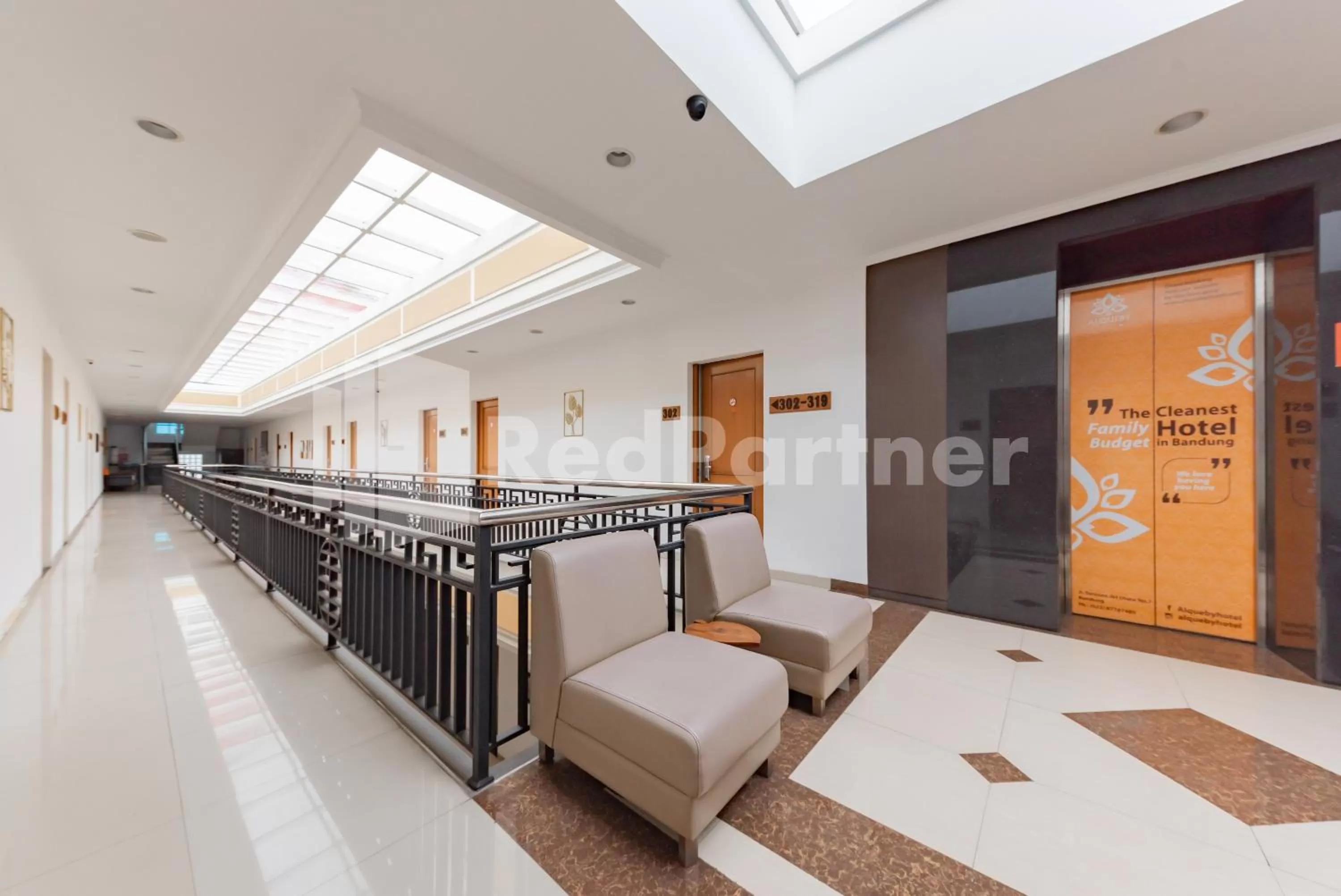 elevator in Alqueby Hotel near Kiara Artha Park & Trans Studio Mall Mitra RedDoorz