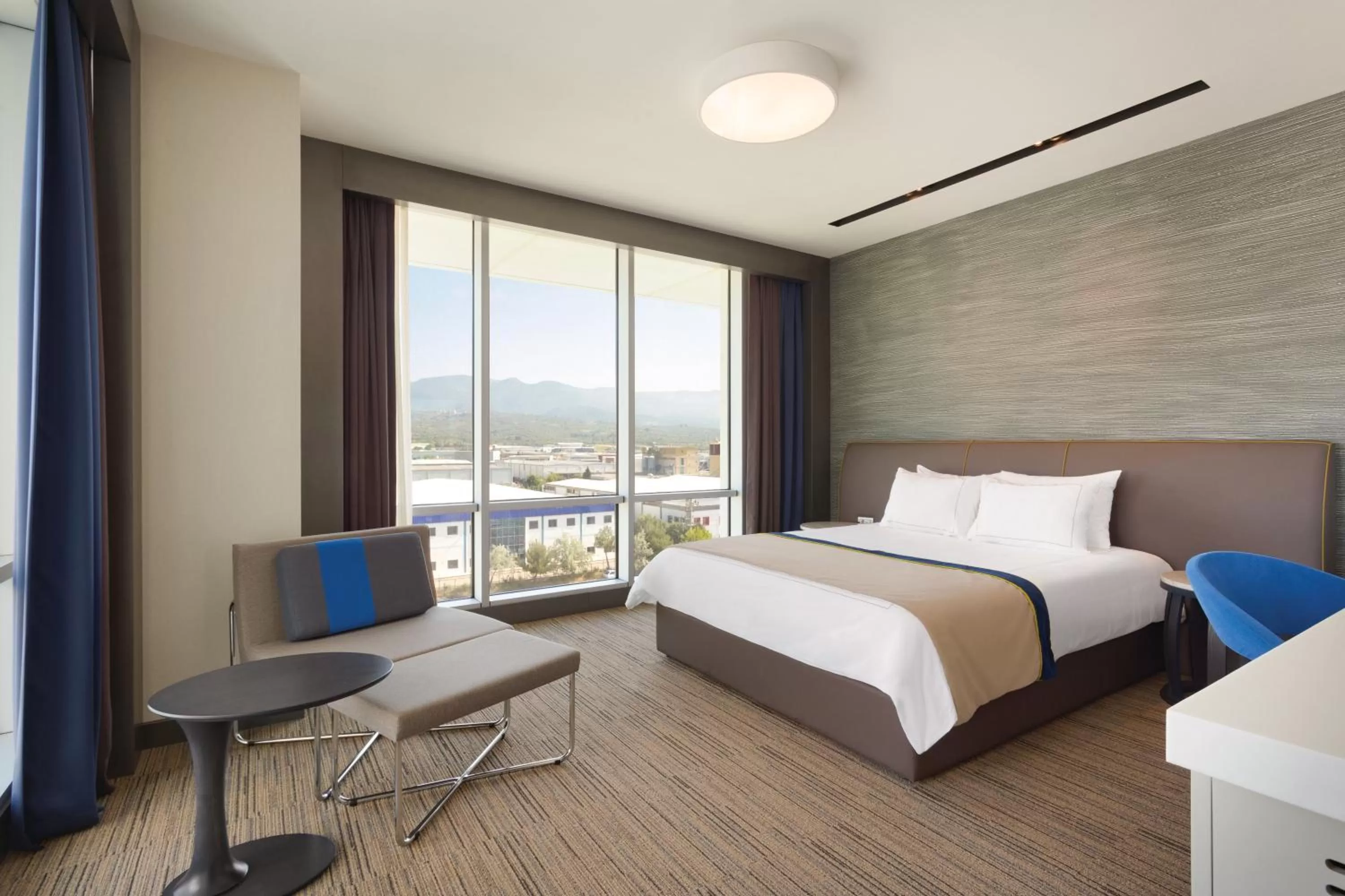 Photo of the whole room, Bed in Ramada Hotel & Suites by Wyndham Izmir Kemalpasa