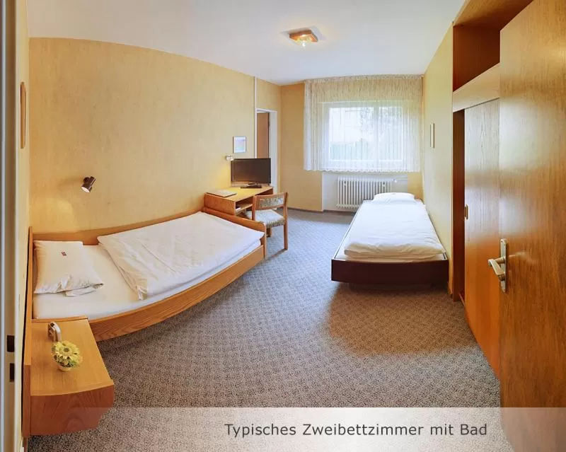 Photo of the whole room, Bed in Hotel Keinath Stuttgart