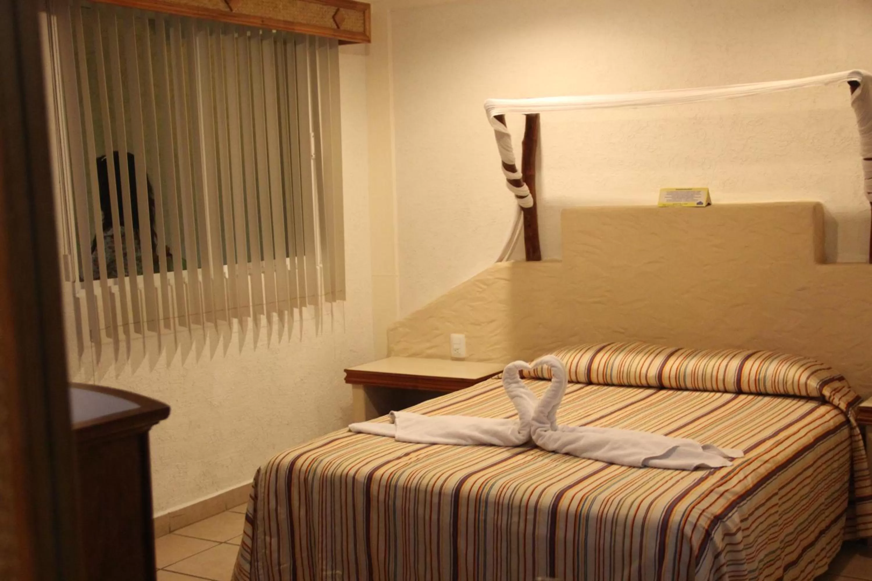 Bed in Hotel Palapa Palace