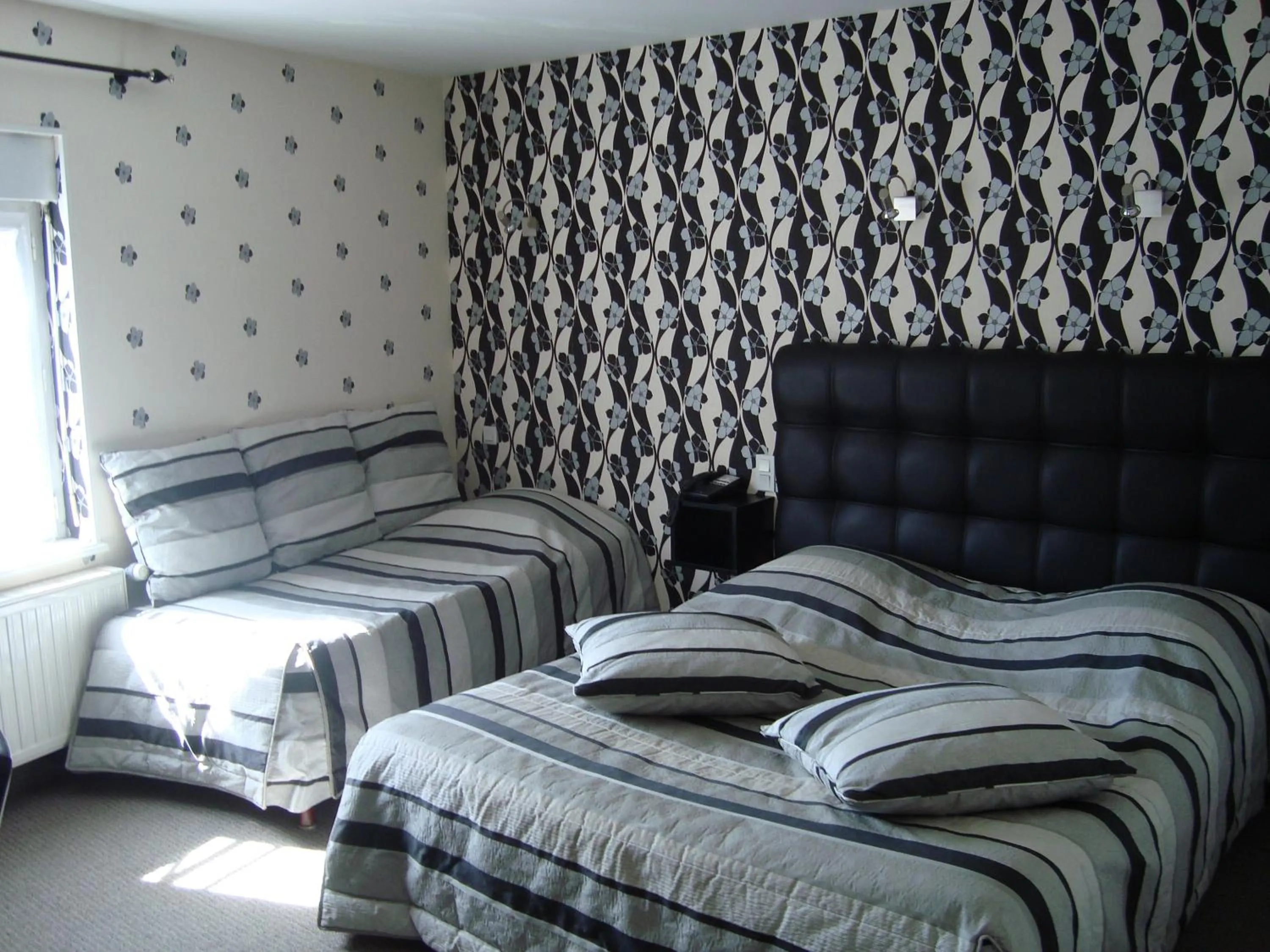 Photo of the whole room, Bed in Hôtel de La Croix d'Or