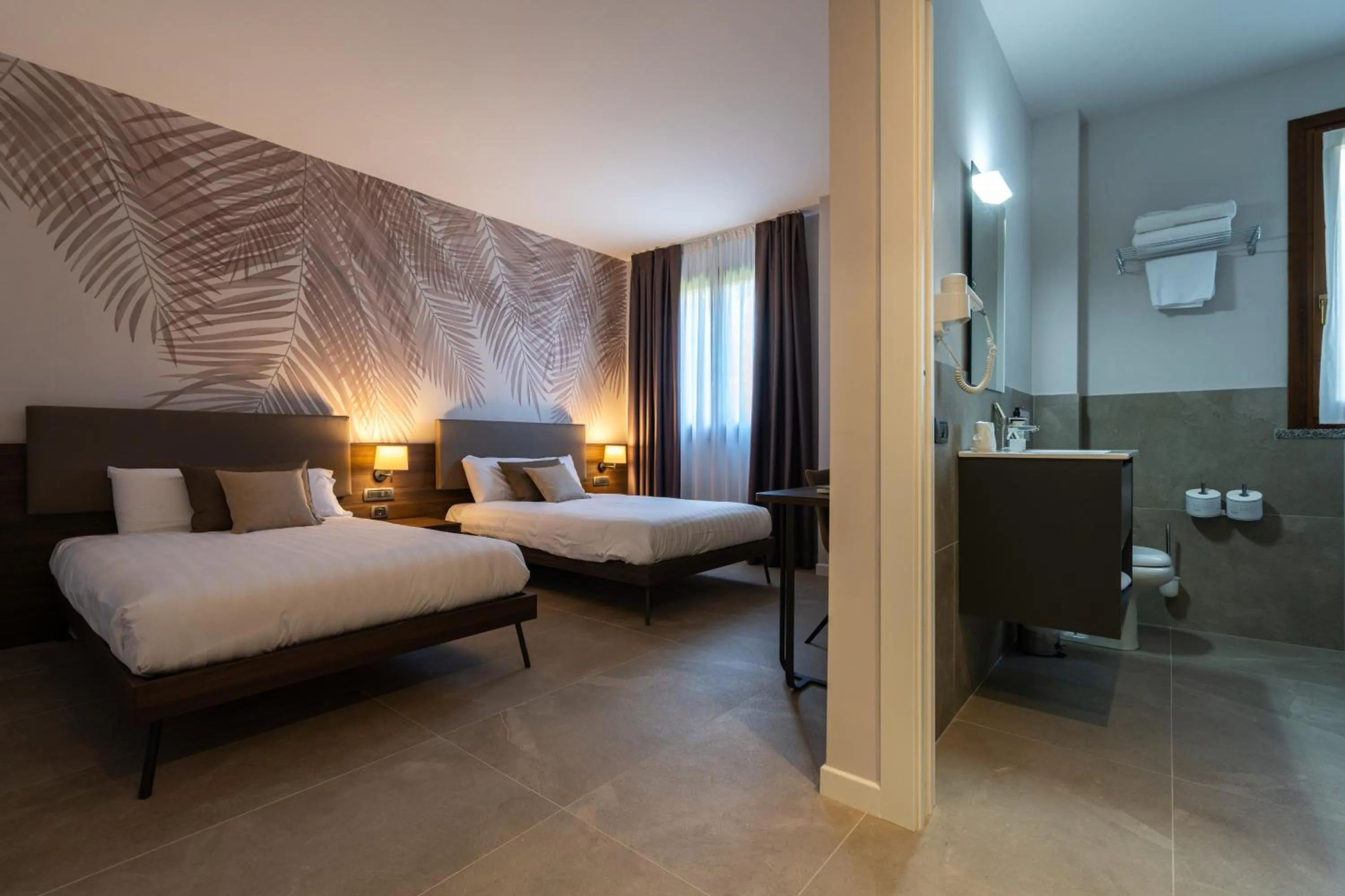 Bed in Ulivi Hotel & Residence