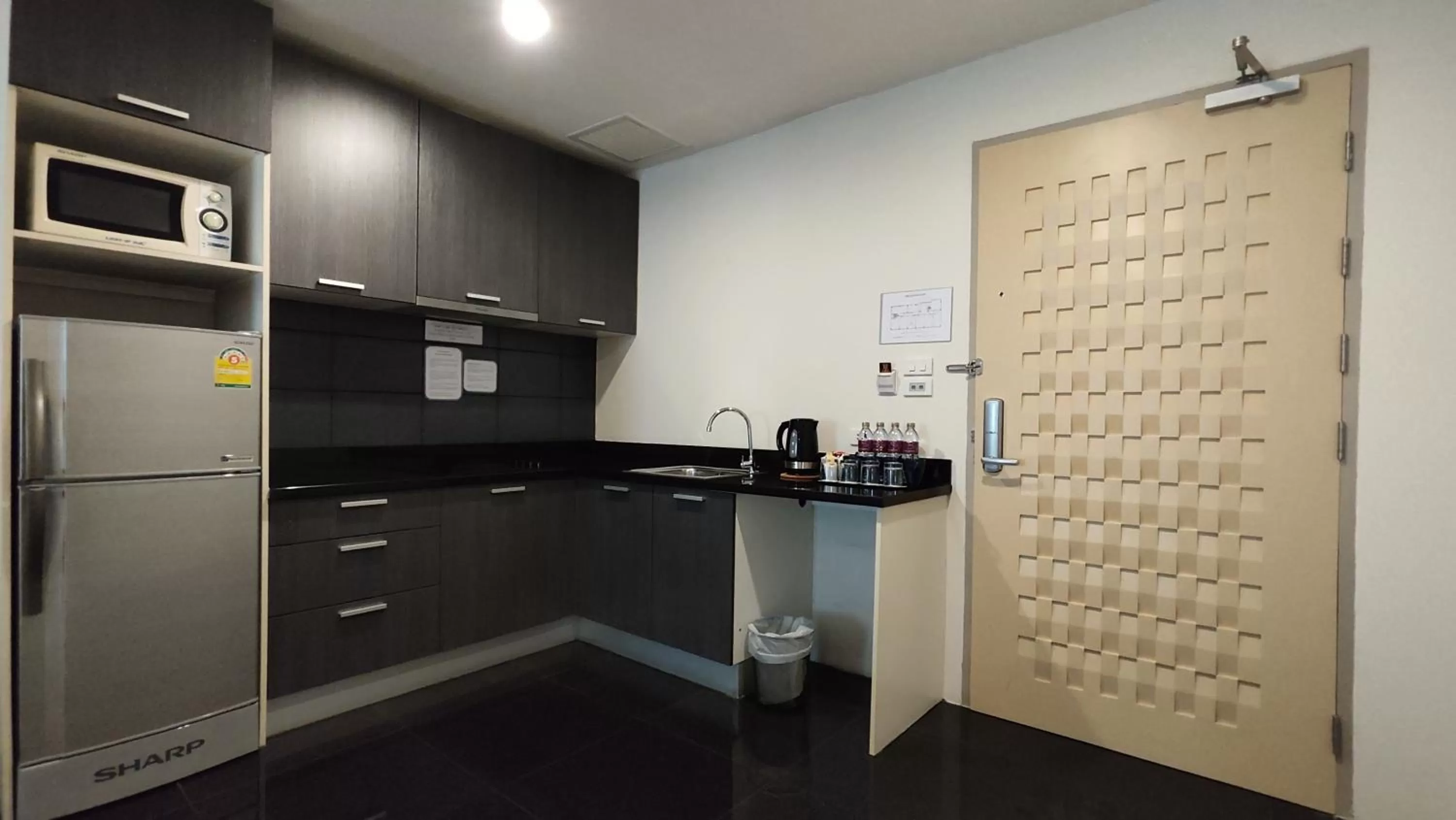 Kitchen or kitchenette in The Bless Hotel and Residence