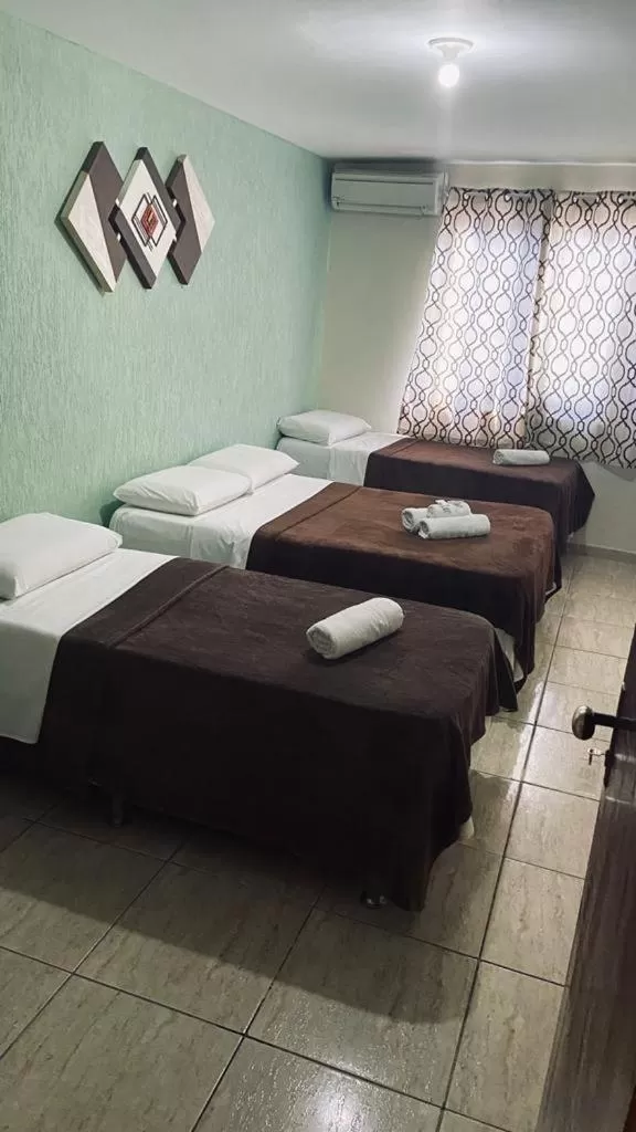 Bed in Pousada Córdoba Cabo Frio