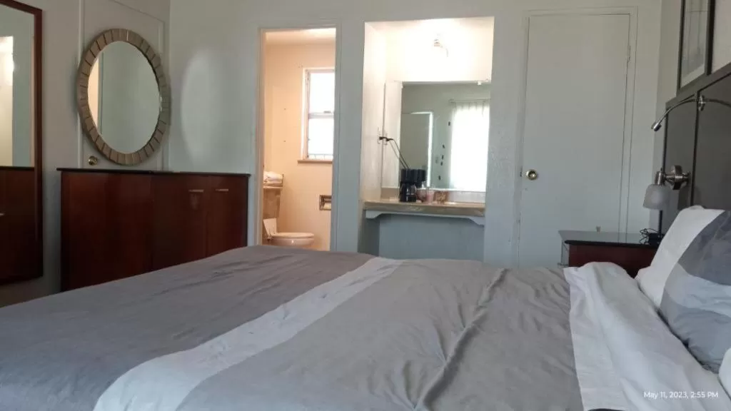 Bed in Travelers Beach Inn