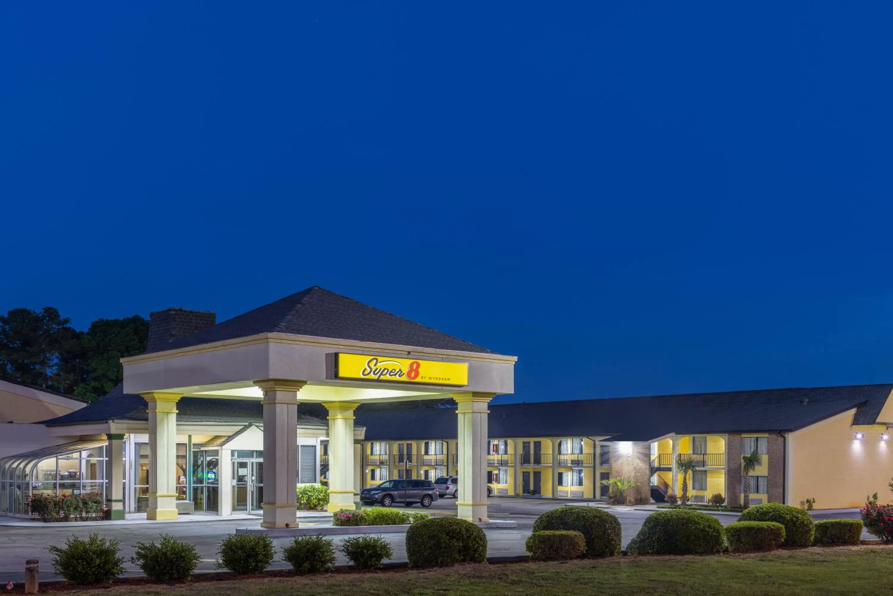 Property building in Super 8 by Wyndham McDonough GA