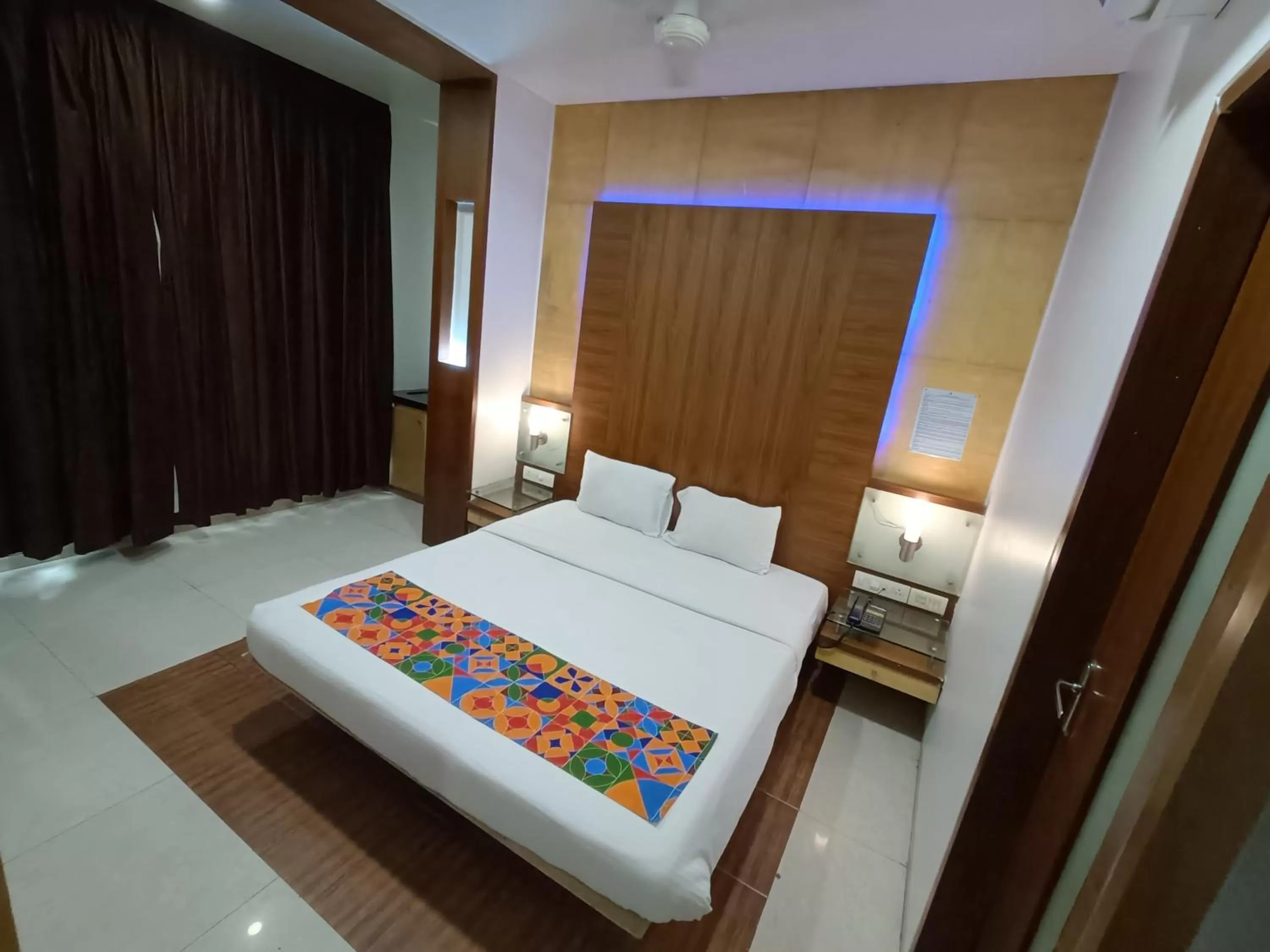 Bed in Rapid Lakme Executive Hotel